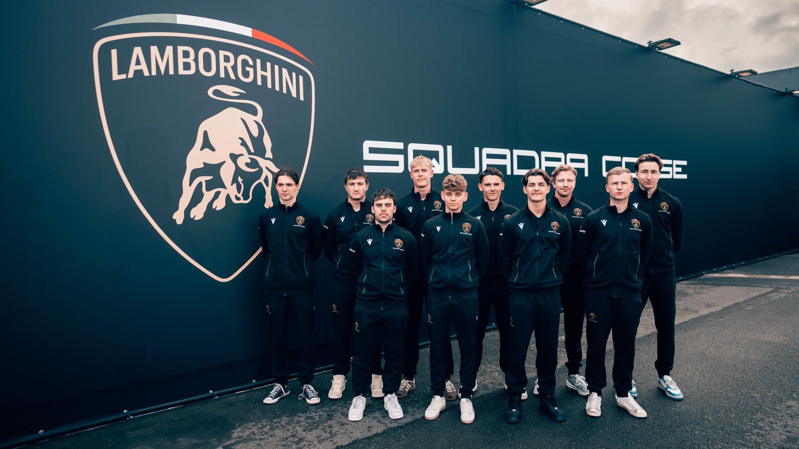 2025 Lamborghini Young Driver Program intake standing in front of Squadra Corse branding