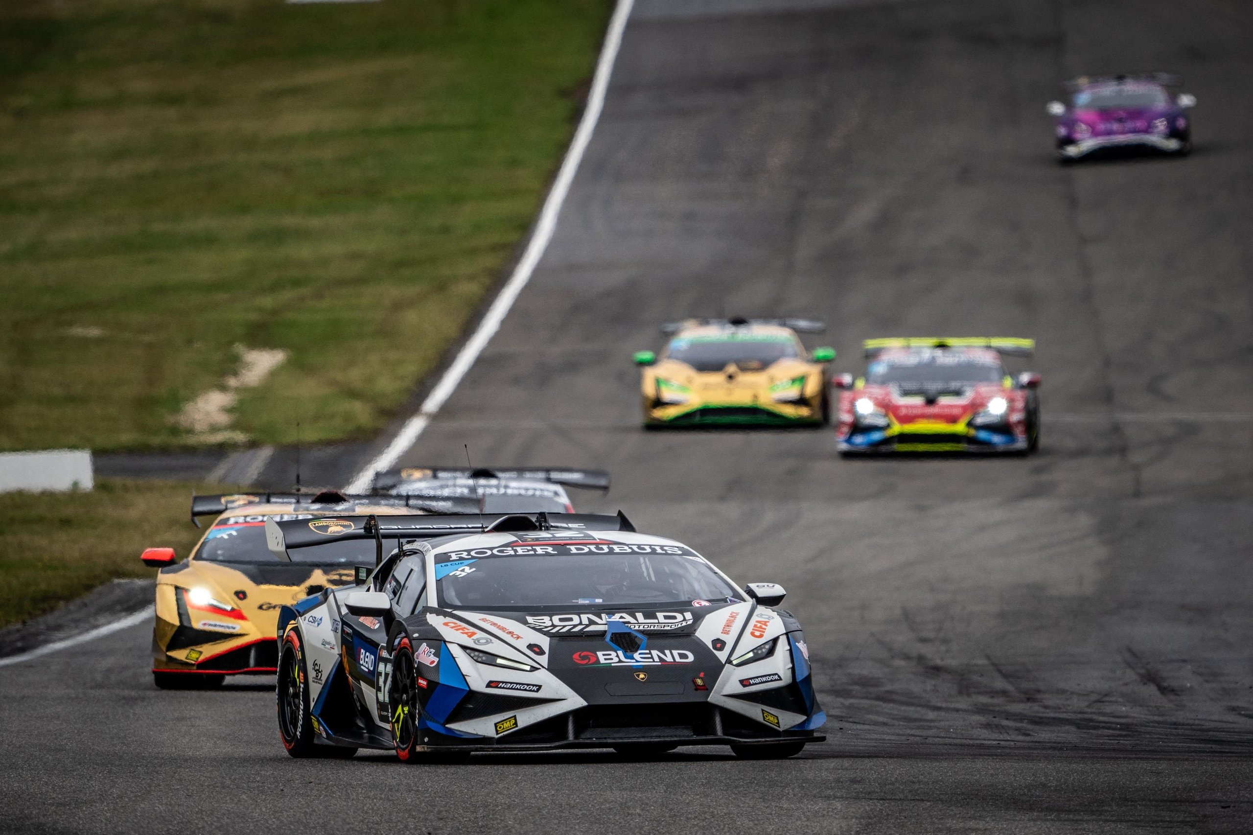 Brendon Leitch'S Late-Race Dummy Move At Nürburgring Delivers Leipert Motorsport'S First Overall Super Trofeo Win 7 Multiple lamborghini huracán super trofeo evo2 race cars in various liveries competing closely on track