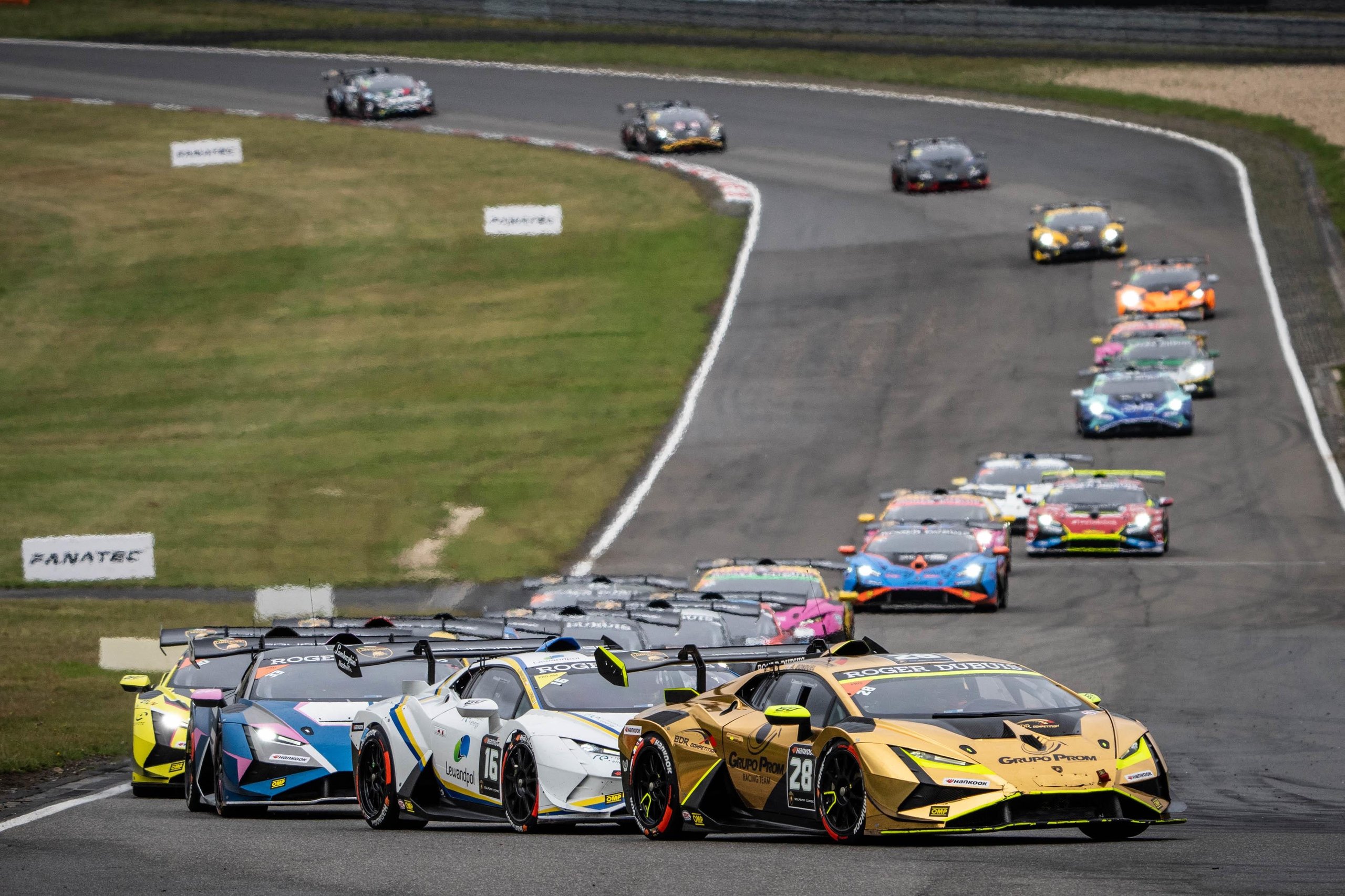 Brendon Leitch'S Late-Race Dummy Move At Nürburgring Delivers Leipert Motorsport'S First Overall Super Trofeo Win 11 Large field of lamborghini huracán super trofeo evo2 race cars in colorful liveries navigating a turn at nürburgring