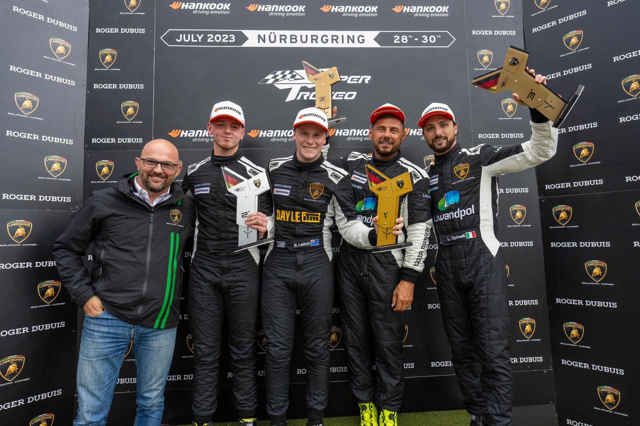 Brendon Leitch'S Late-Race Dummy Move At Nürburgring Delivers Leipert Motorsport'S First Overall Super Trofeo Win 9 Race winners and team personnel celebrating on the podium with trophies at nürburgring