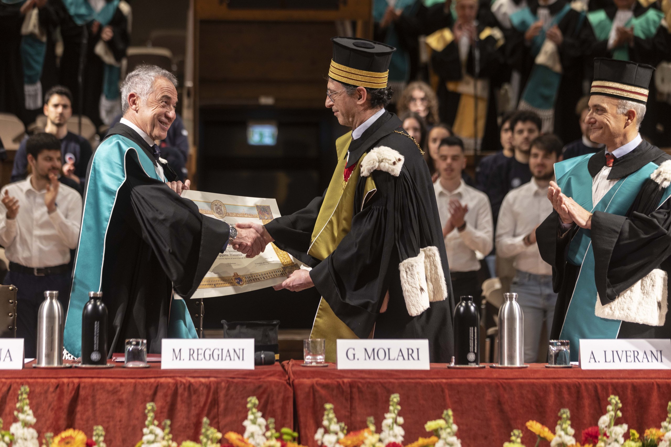 The Engineer Behind 160 Patents And Five Iconic Lamborghinis Earns Bologna'S Rarest Honor 5 Maurizio reggiani shaking hands with rector giovanni molari during the honorary degree ceremony