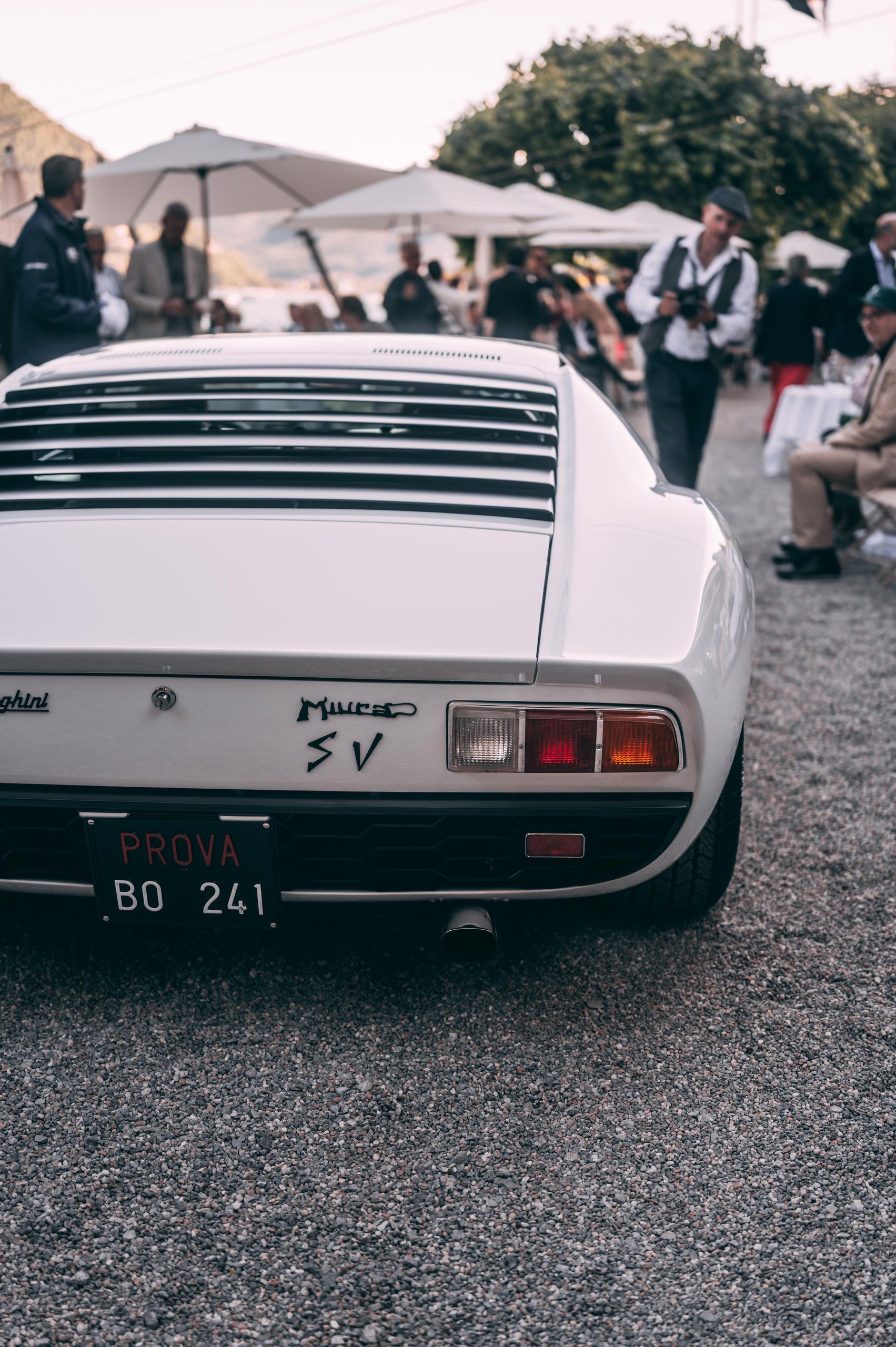 A 1971 Miura Sv Just Won At Villa D'Este, And Its 60Th Anniversary Timing Could Not Be Better 5 Close-up of the rear of a white lamborghini miura sv showing taillights, miura sv badging, and rear louvers