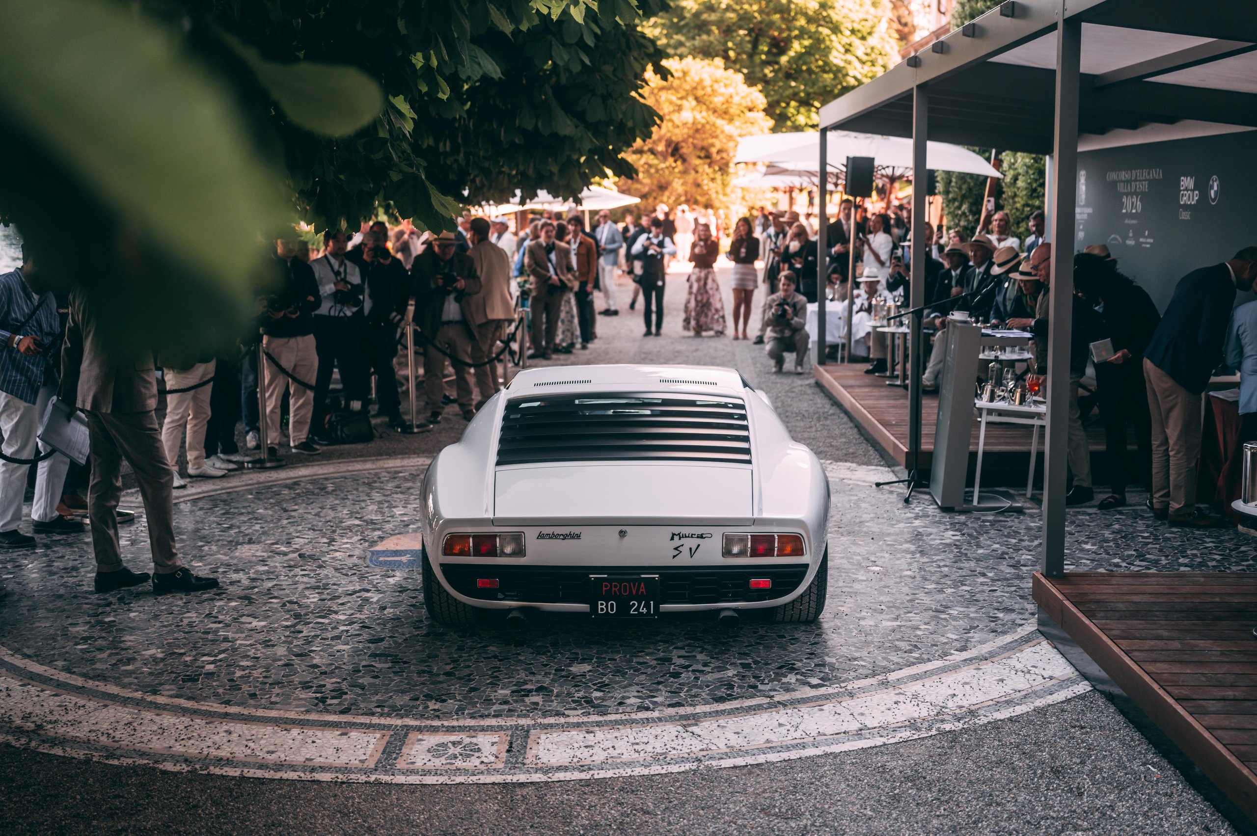 A 1971 Miura Sv Just Won At Villa D'Este, And Its 60Th Anniversary Timing Could Not Be Better 11 White lamborghini miura sv parked on decorative paving at villa d'este, surrounded by admiring attendees