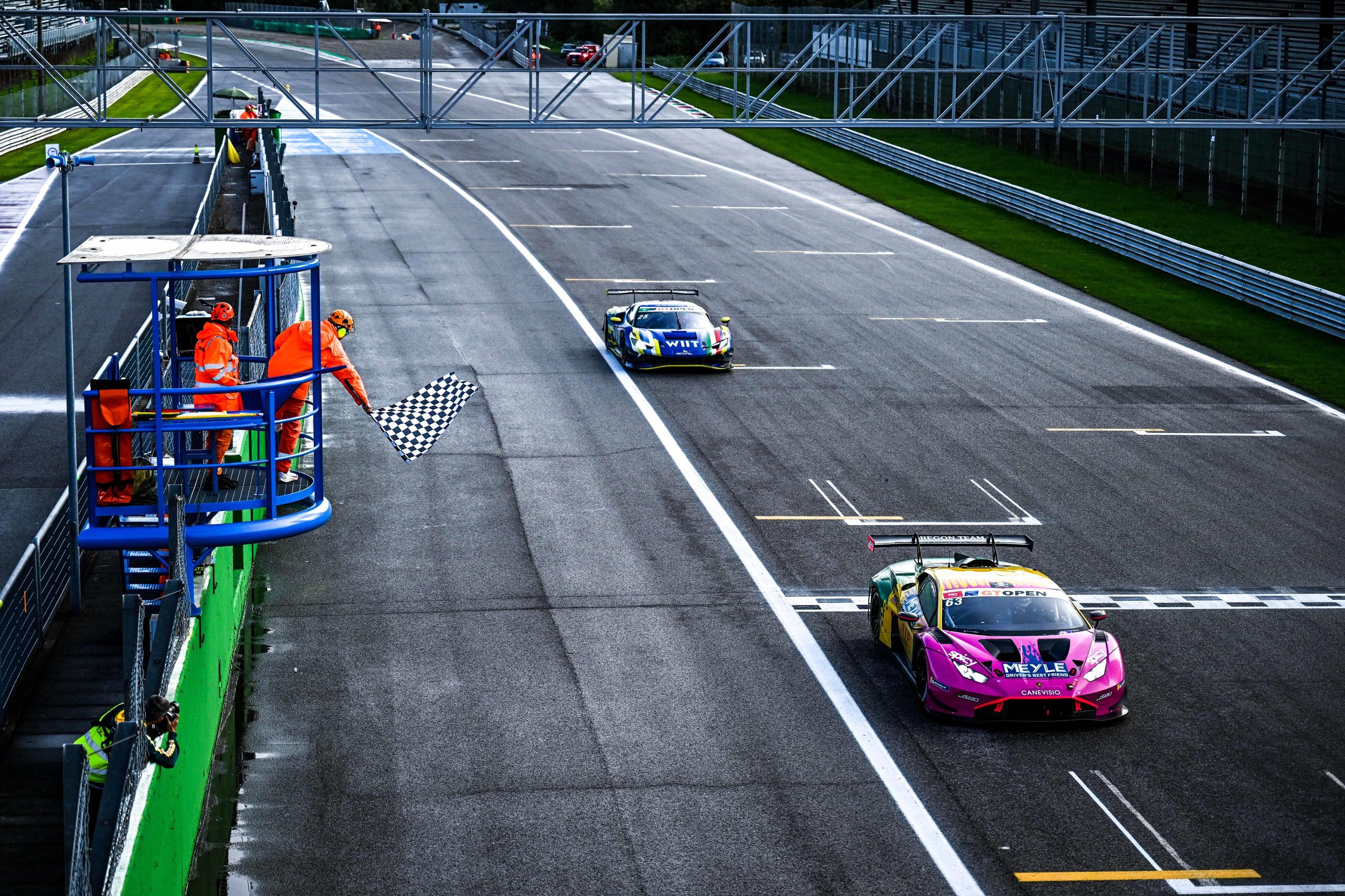 Oregon Team'S Tire Gamble And Four-Hundredths Finish Keep Lamborghini'S Gt Open Title Hopes Alive At Monza 3 The #63 oregon team lamborghini huracán gt3 evo2 crosses the finish line at monza under the checkered flag