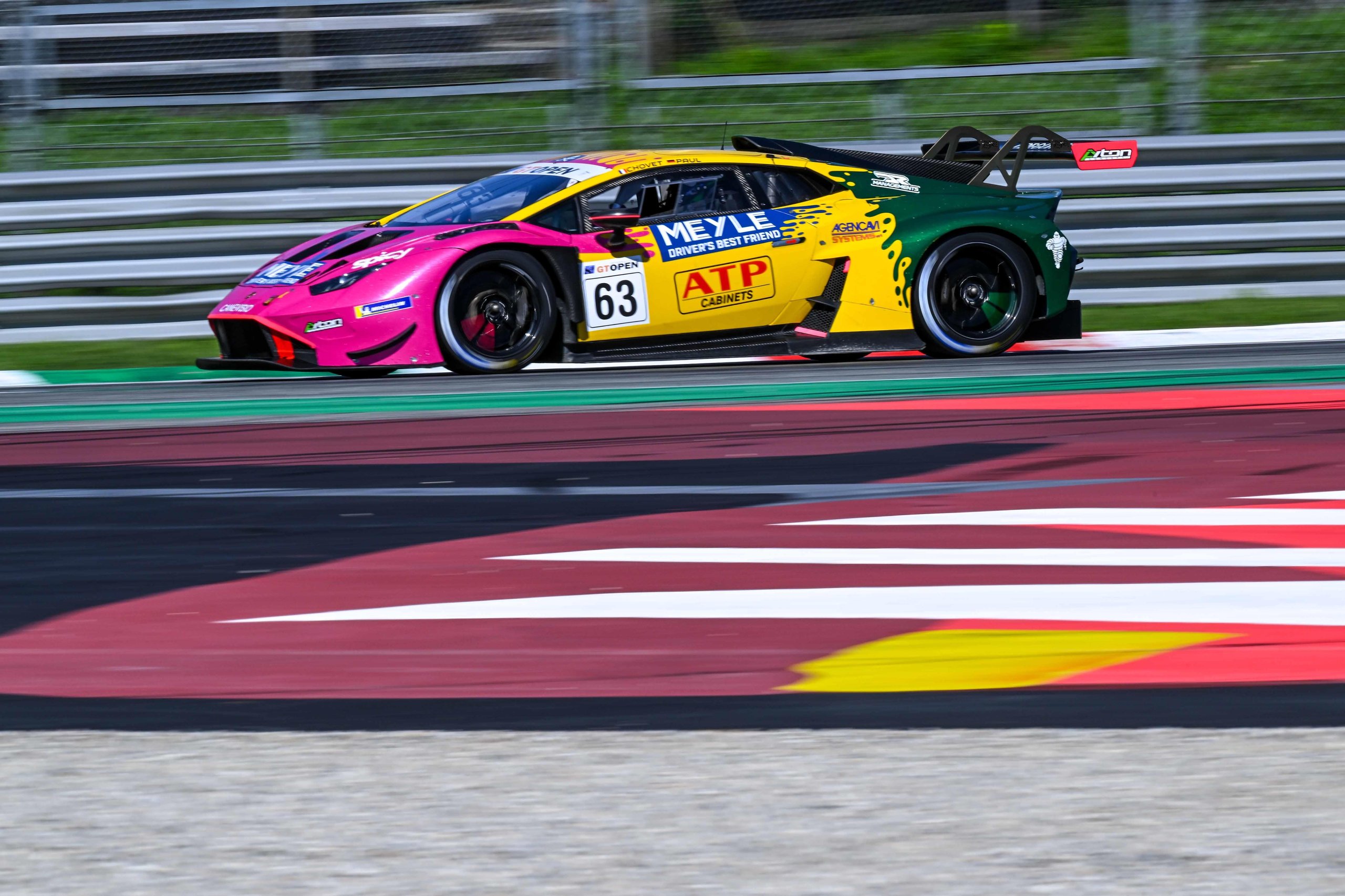 Oregon Team'S Tire Gamble And Four-Hundredths Finish Keep Lamborghini'S Gt Open Title Hopes Alive At Monza 7 Side profile of the #63 oregon team lamborghini huracán gt3 evo2 at speed on the monza circuit, showing carbon fiber aero elements and rear wing
