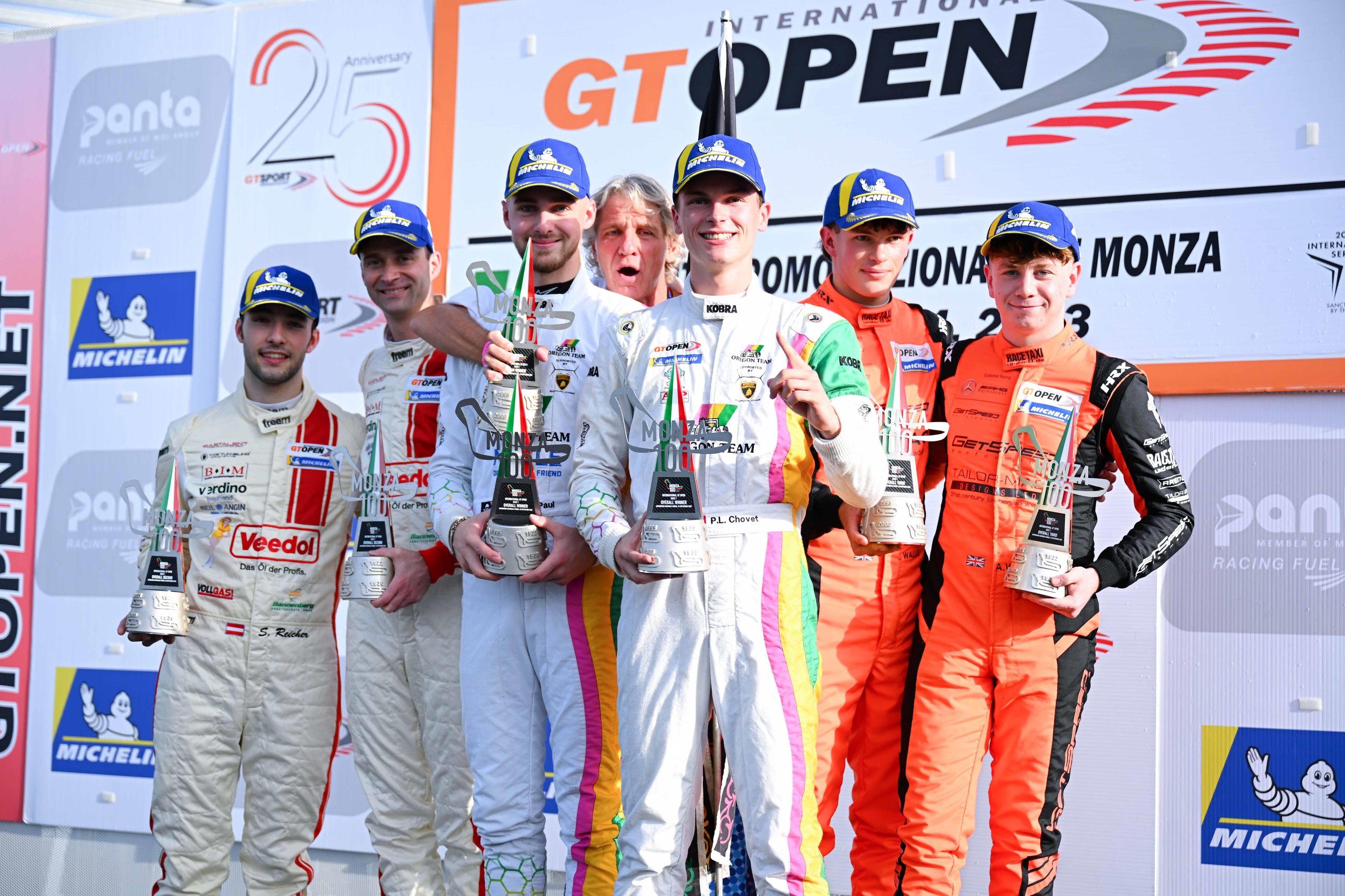 Oregon Team'S Tire Gamble And Four-Hundredths Finish Keep Lamborghini'S Gt Open Title Hopes Alive At Monza 5 Oregon team drivers paul and chovet celebrate on the podium with trophies alongside team members after the monza gt open round