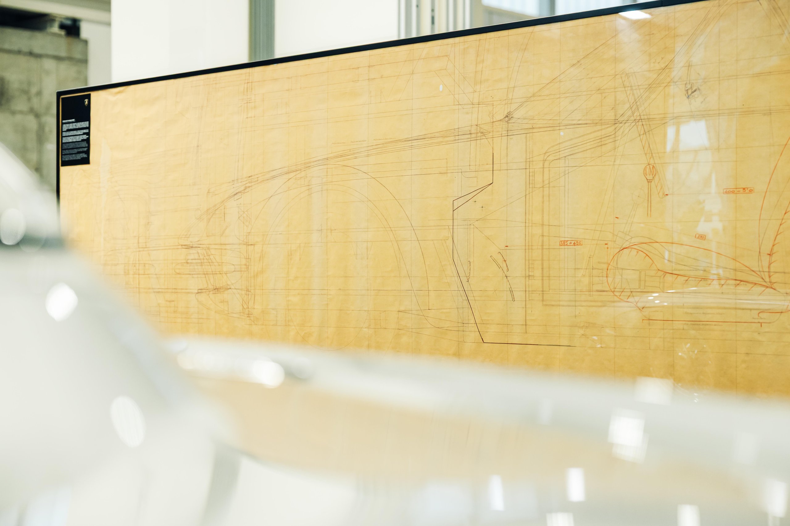 Polo Storico'S Oldest Surviving Lamborghini And A 2026 Miura Tour Signal Where The Brand'S Heritage Strategy Is Heading 7 Large framed technical drawing of a classic lamborghini displayed at an event