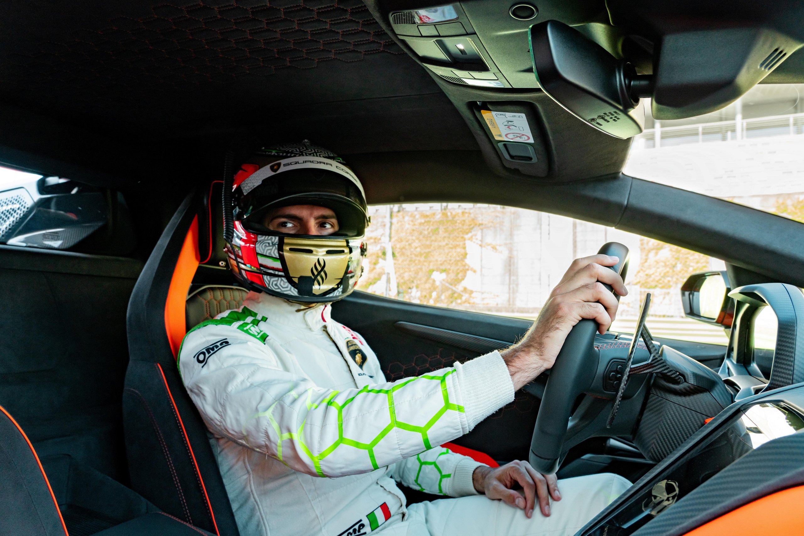 Factory Driver Caldarelli Puts The Revuelto Through Its Paces At Vallelunga, And His Verdict Tells Us More Than The Spec Sheet 5 Andrea caldarelli in helmet looking at camera from the revuelto cockpit, hexagonal stitching and carbon fiber trim visible