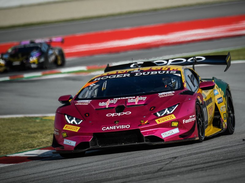 Oregon Team's number 11 Lamborghini Huracán Super Trofeo EVO2 racing at Barcelona with prominent rear wing and LED headlights visible