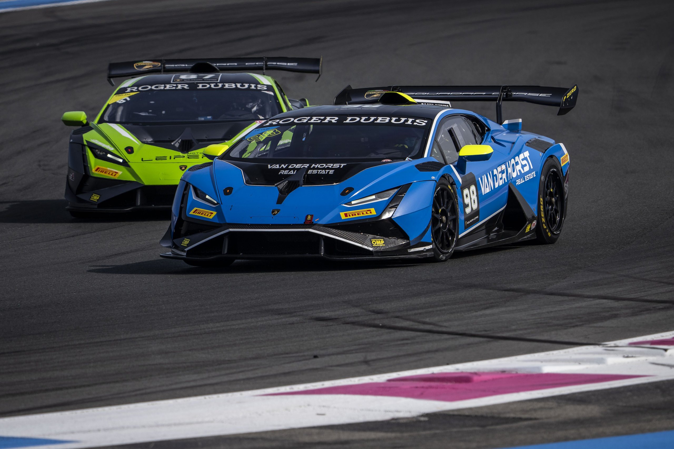 Pedrosa Returns, A Perfect Streak Faces Misano'S Evening Grid, And Four Classes Fight For Points 7 A blue and black lamborghini huracán super trofeo evo2 number 98 closely followed by a lime green and black car on track