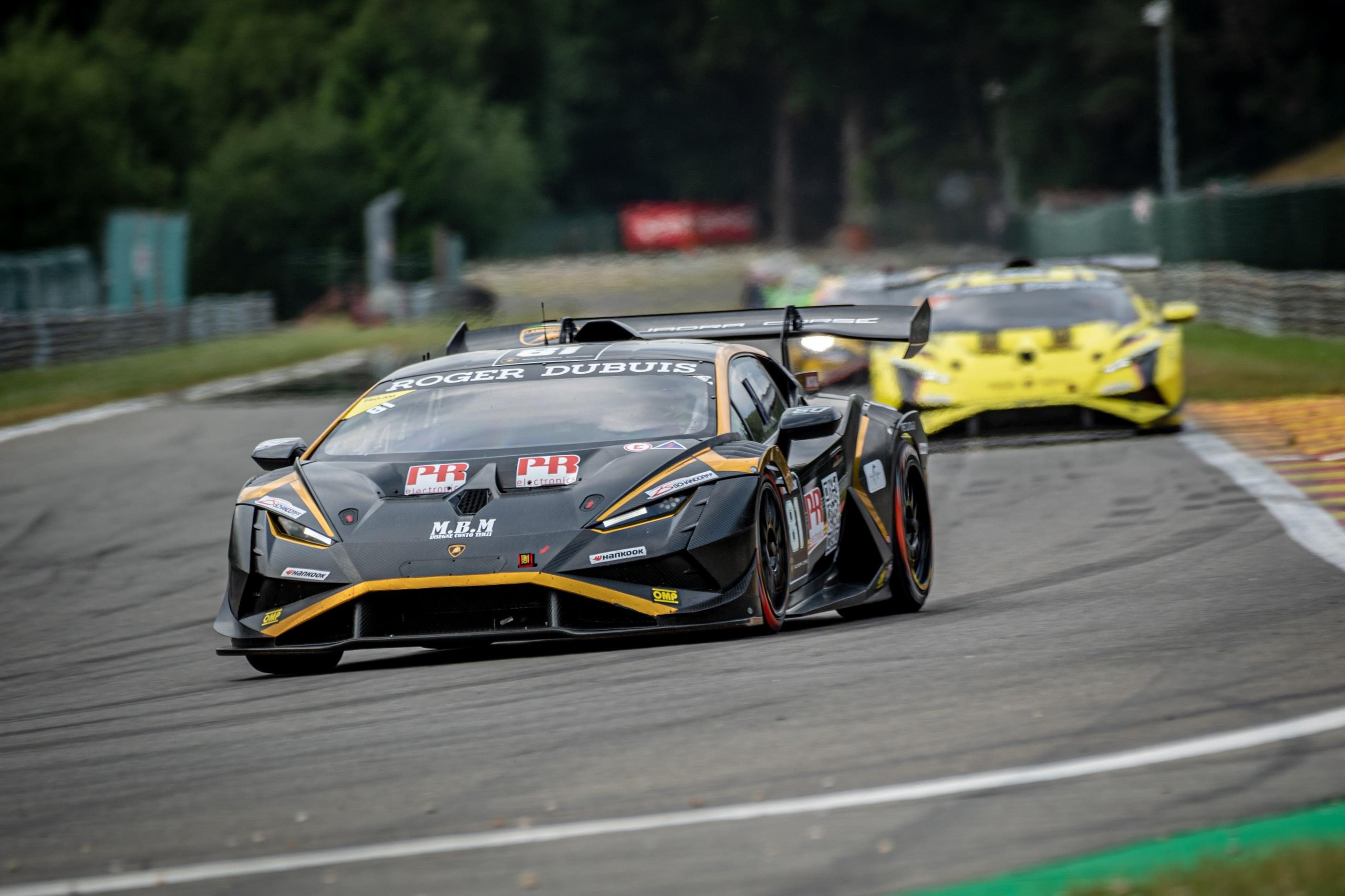 Half A Point Separates The Pro Leaders As Super Trofeo Europe Returns To The Nürburgring 5 Black and gold lamborghini huracán super trofeo evo2 number 11 leading a yellow lamborghini on track