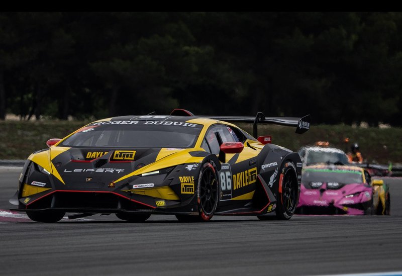 Yellow and black Lamborghini Huracán Super Trofeo EVO2 number 86 racing on track with prominent rear wing and Roger Dubuis livery