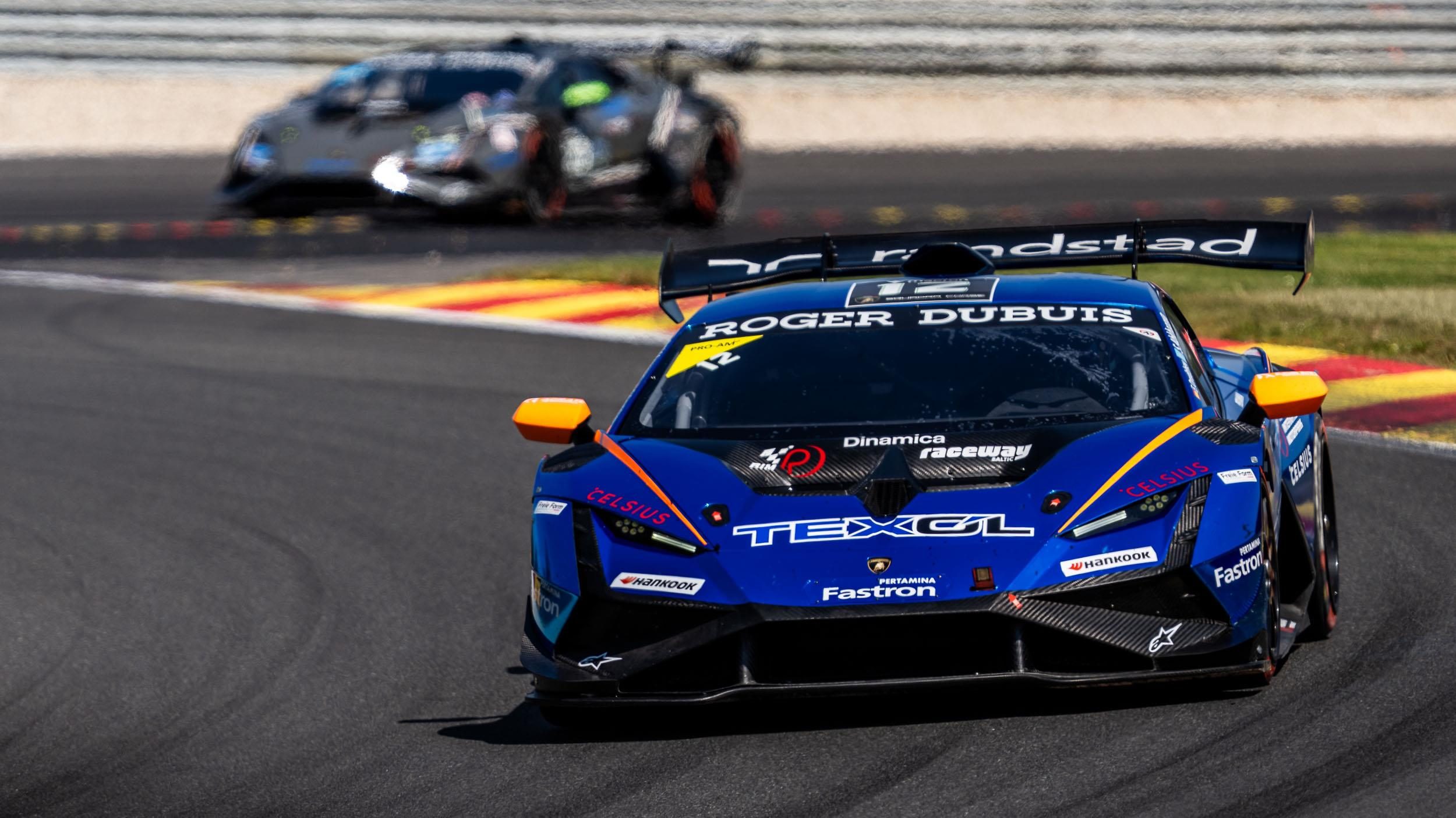 A blue and orange lamborghini huracán super trofeo evo2 racing on track at spa-francorchamps