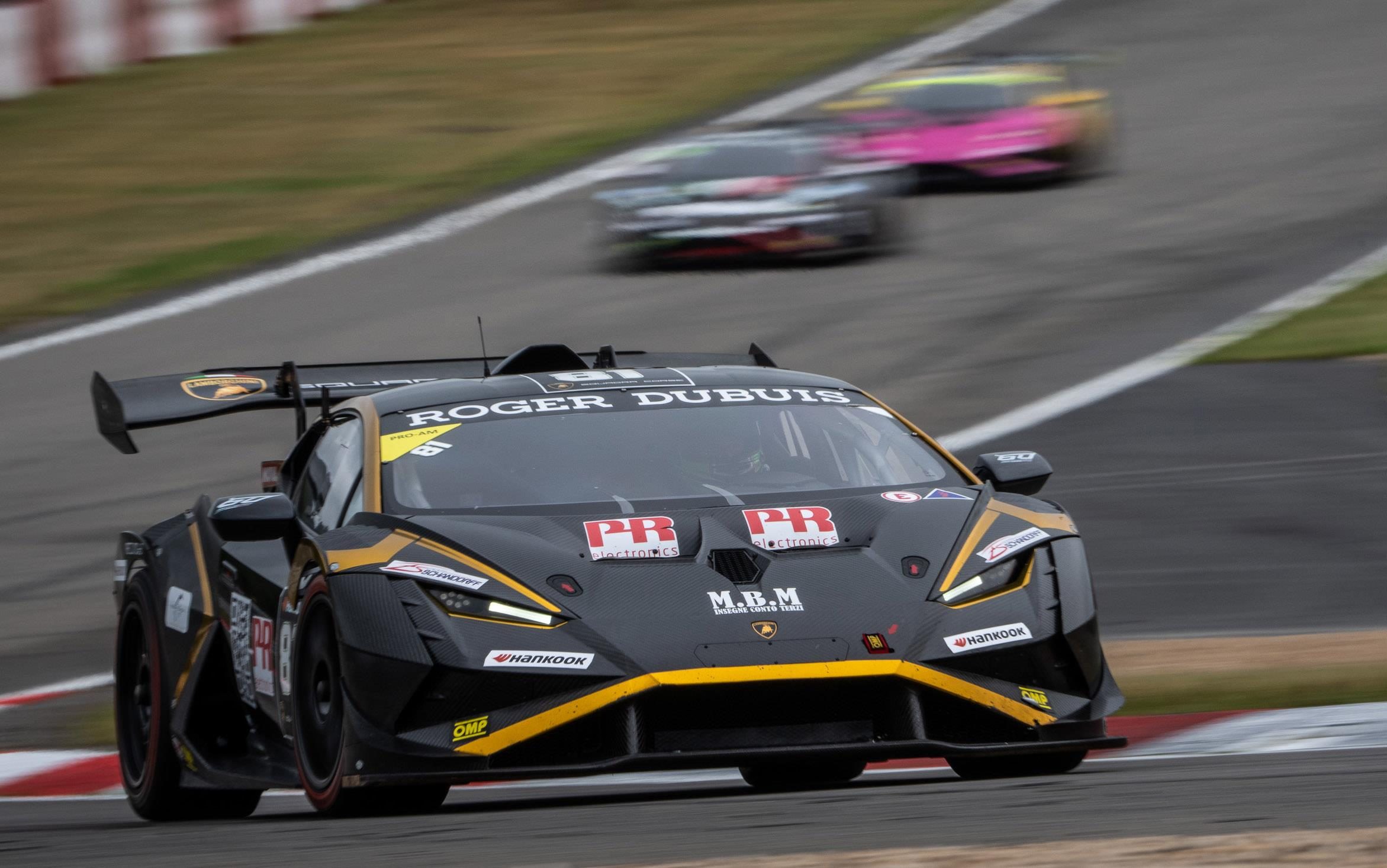 Twelve Points Separate Four Crews As Super Trofeo Europe Hits Valencia'S Pressure Cooker 3 Black and yellow lamborghini huracán super trofeo evo2 number 81 leading two rival cars on track