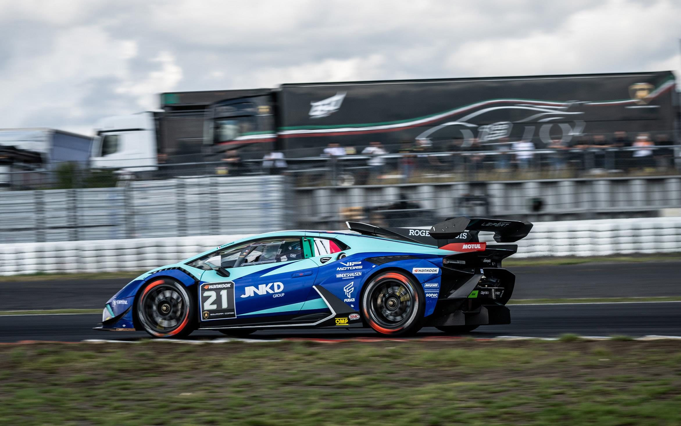 Twelve Points Separate Four Crews As Super Trofeo Europe Hits Valencia'S Pressure Cooker 5 Blue and light blue lamborghini huracán super trofeo evo2 number 21 speeding past spectators on a race circuit