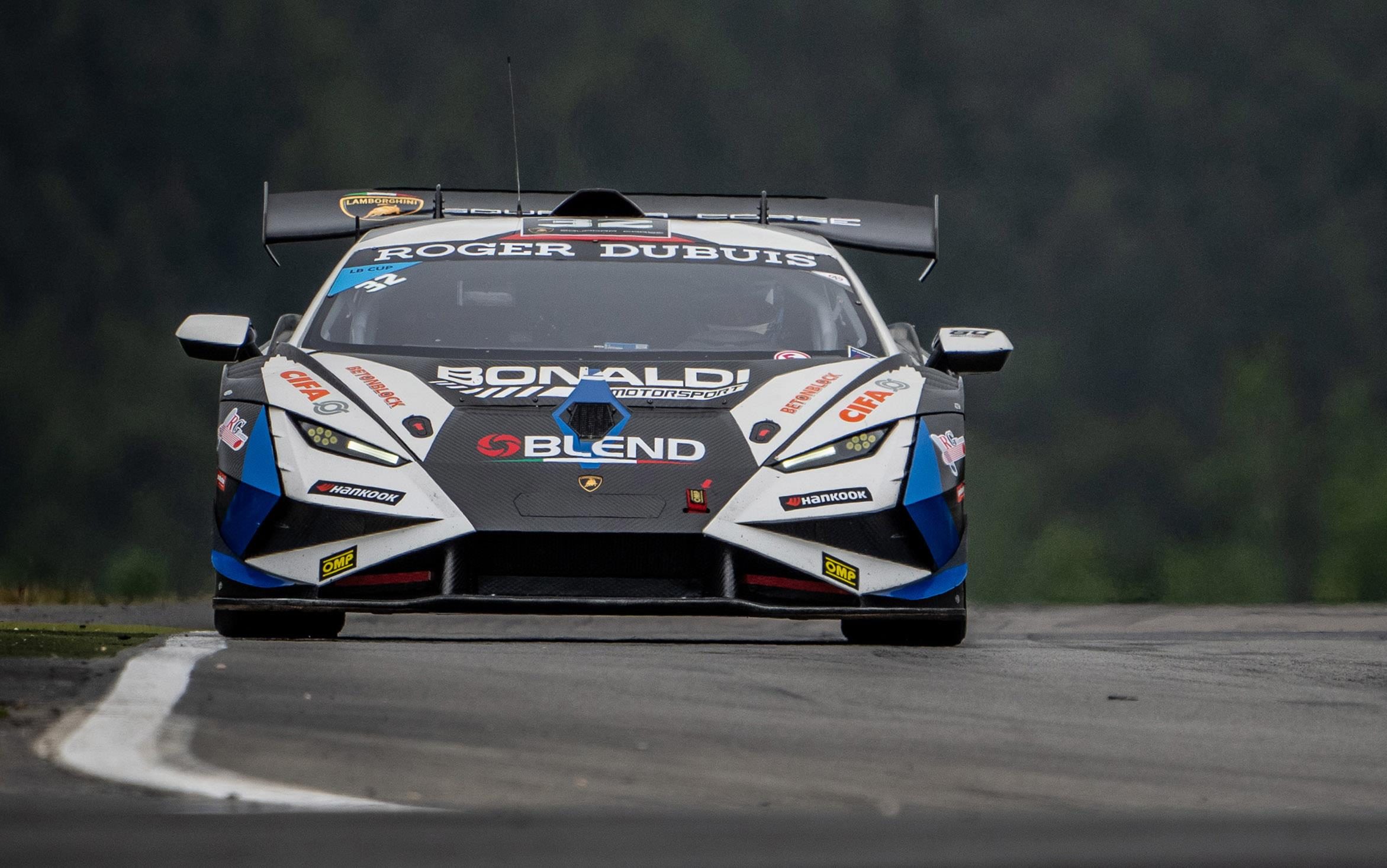 Twelve Points Separate Four Crews As Super Trofeo Europe Hits Valencia'S Pressure Cooker 7 White, black, and blue lamborghini huracán super trofeo evo2 number 89 on a wet race track surface