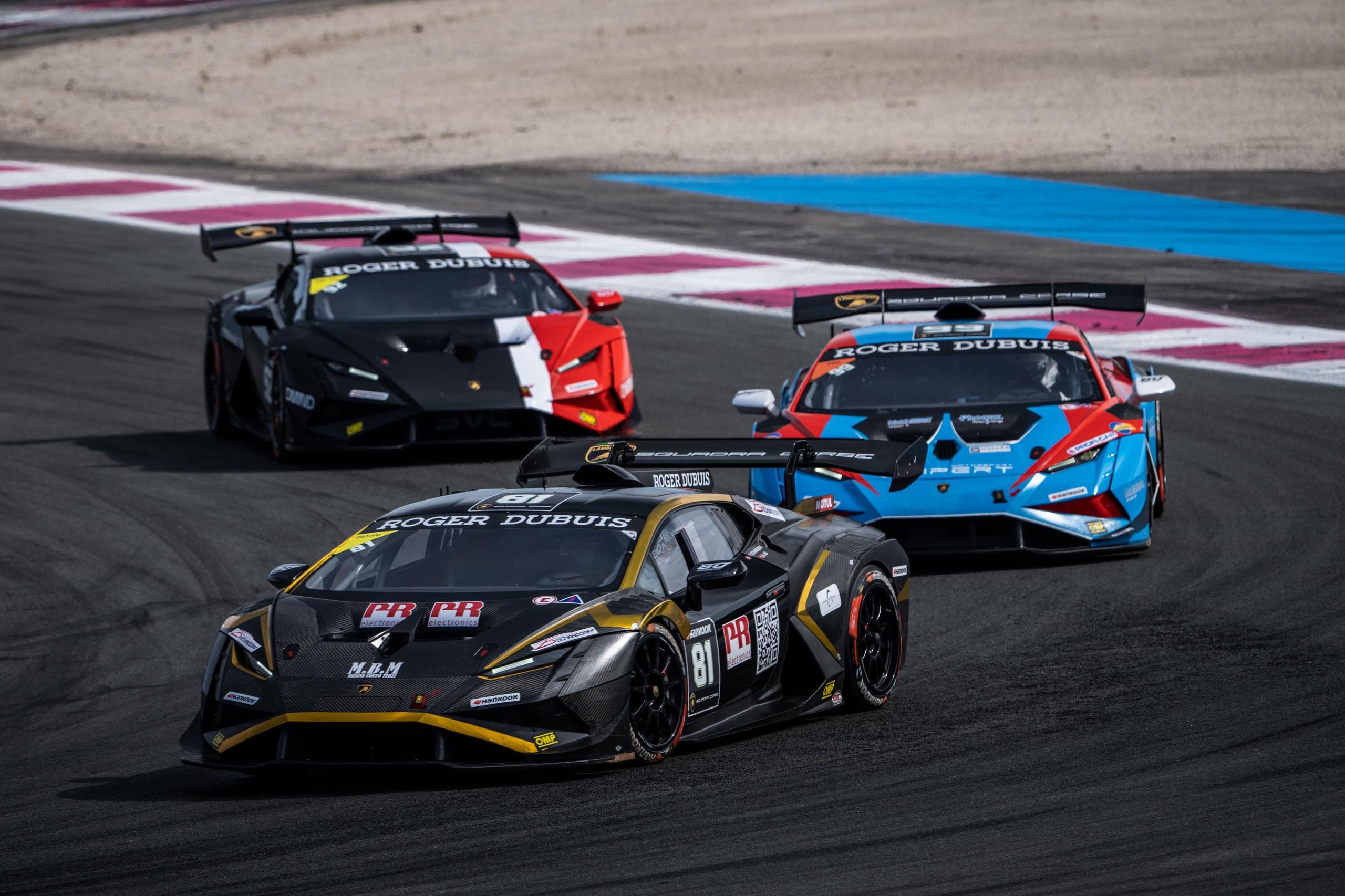 52 Huracán Evo2S At Vallelunga: Why The Super Trofeo'S Record Grid Matters Beyond The Championship Fight 11 Three lamborghini huracán super trofeo evo2 race cars battling for position on track, led by a black and gold liveried car