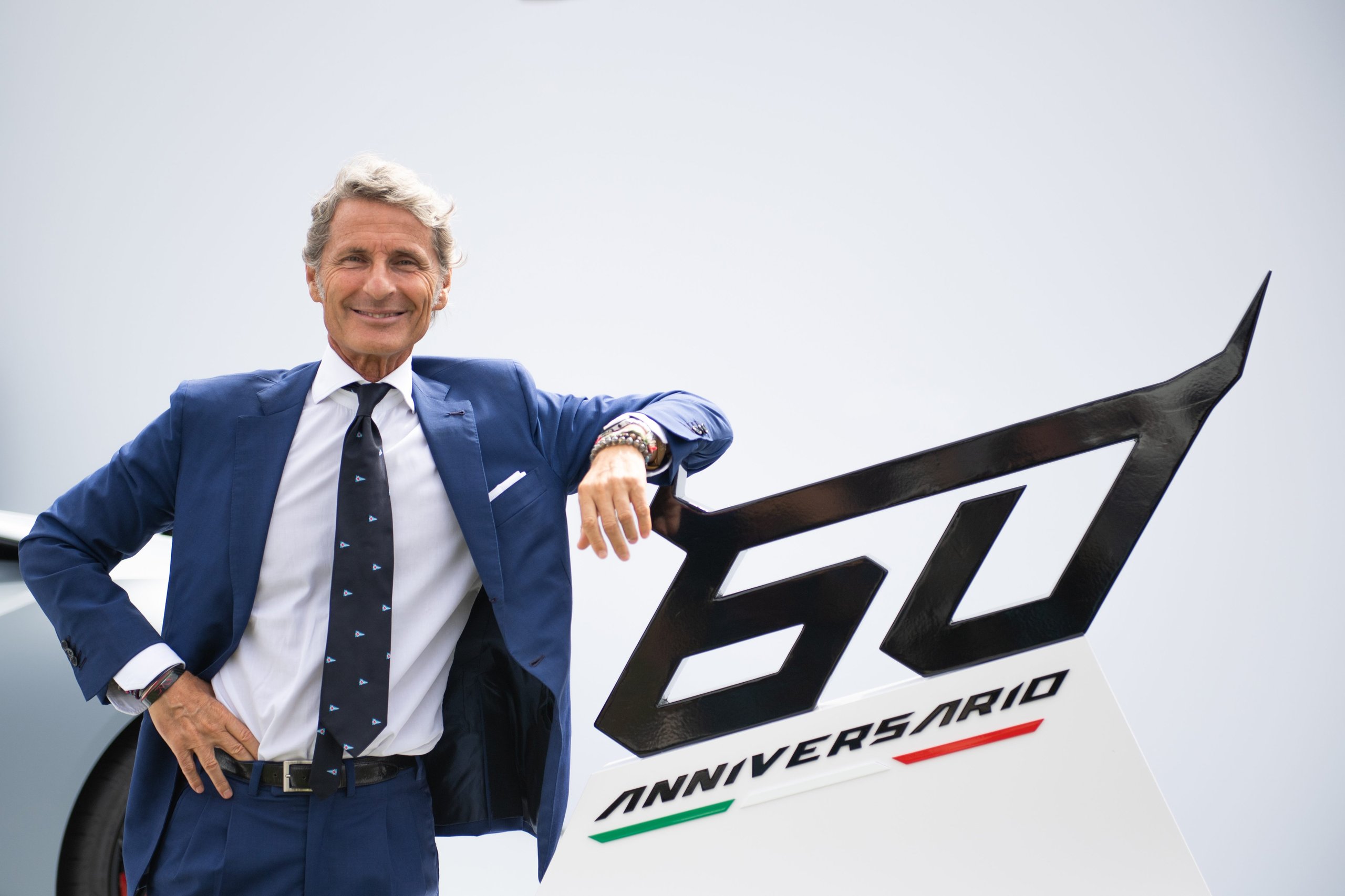 How Lamborghini Turned The Quail Into A Heritage Argument For The Urus Performante 9 Stephan winkelmann smiling while leaning against the 60 anniversario display sign at the quail