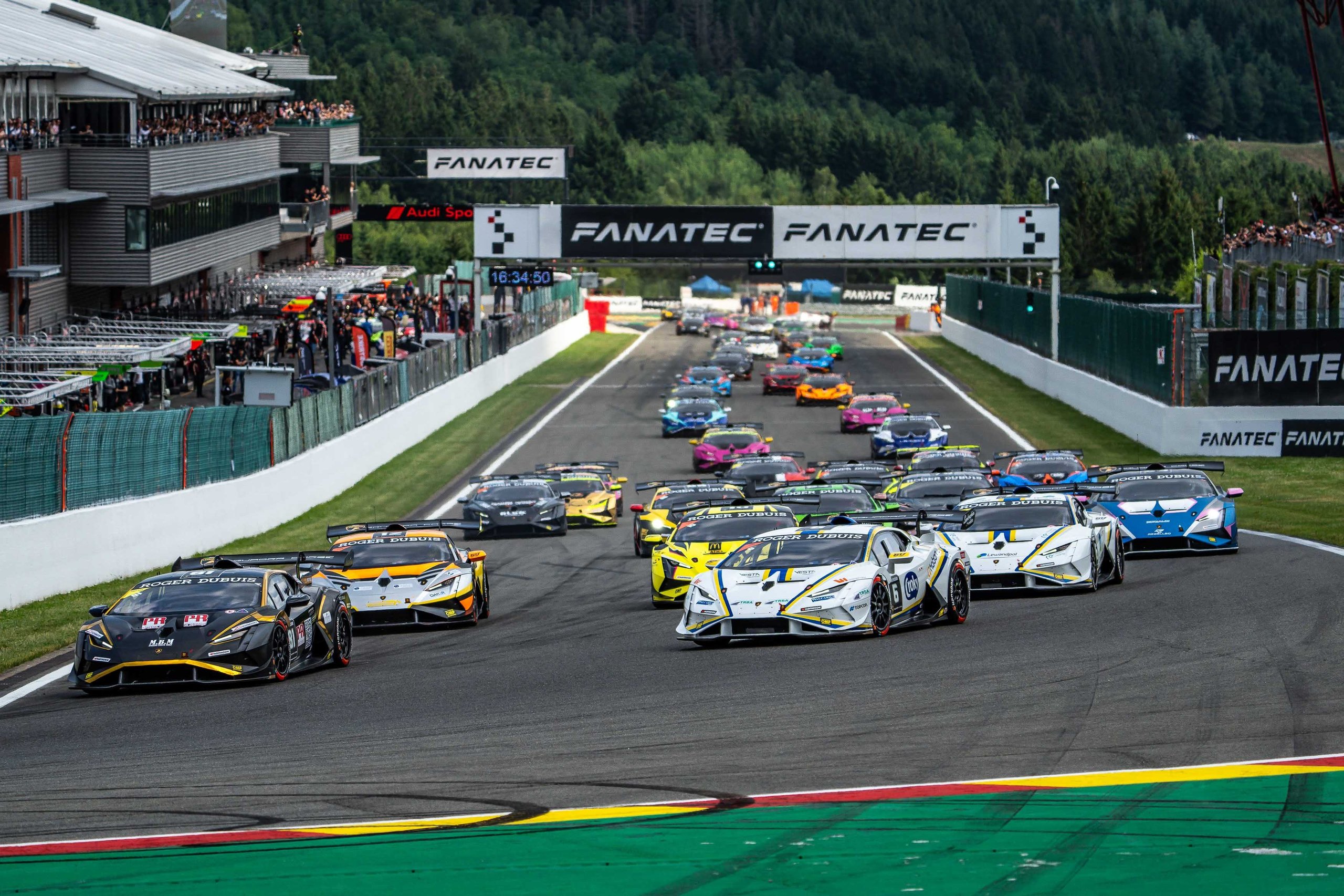 A full grid of lamborghini huracán super trofeo evo2 race cars lined up at spa-francorchamps