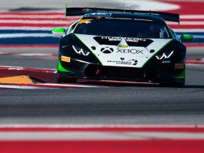 Lamborghini Huracán Super Trofeo race car on track showing aggressive front fascia, large rear wing, and racing livery