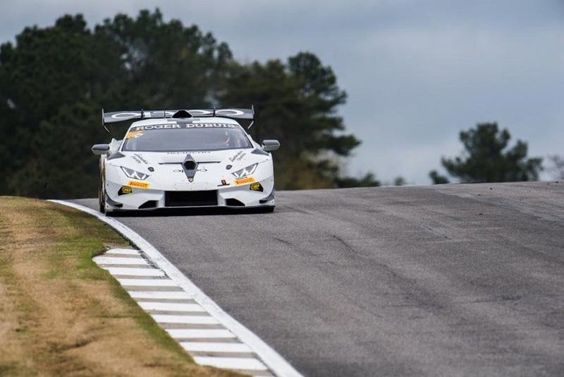 Lamborghini Huracán Super Trofeo EVO navigating Barber Motorsports Park's elevation changes with its large rear wing and roof scoop visible