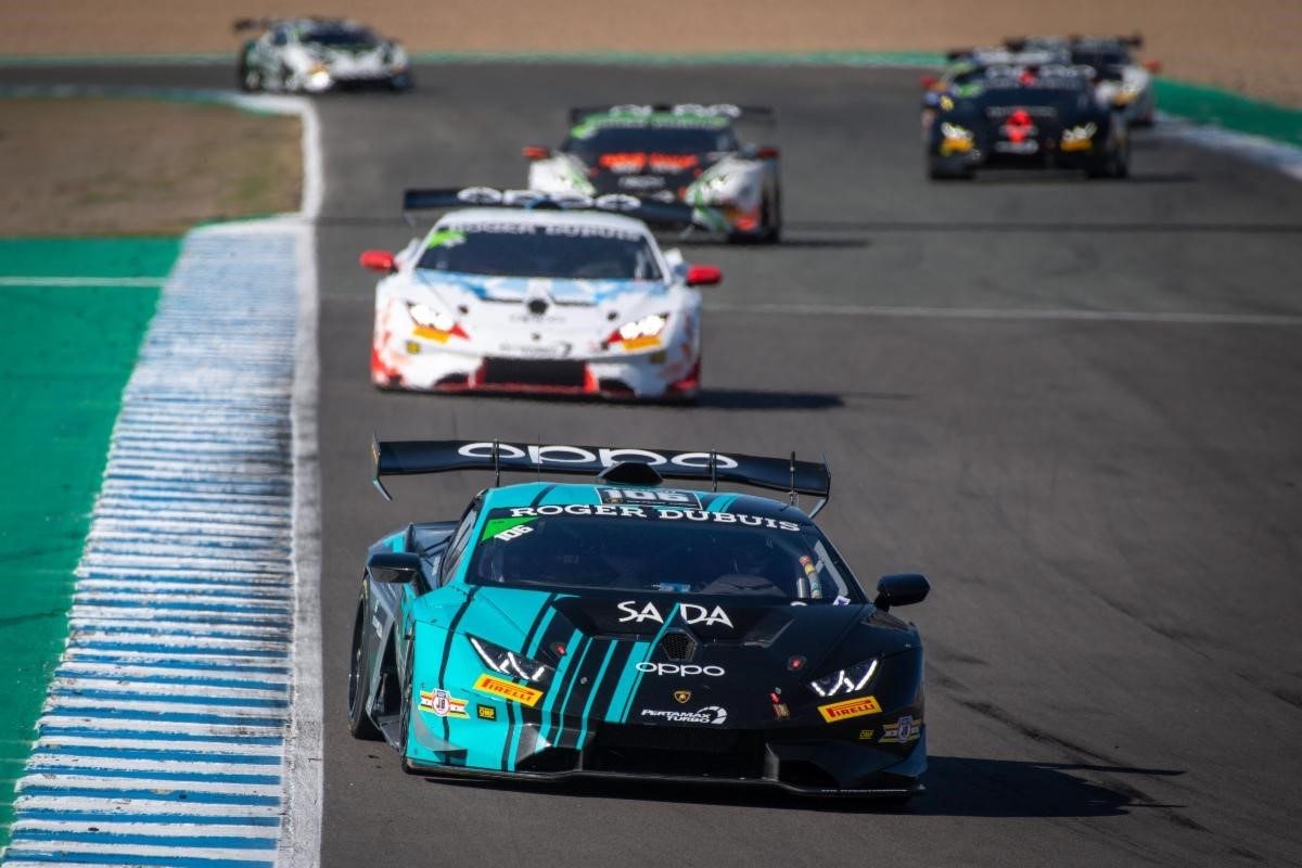 A teal and black Lamborghini Huracan Super Trofeo EVO race car leads a pack of competitors at the Circuito de Jerez during the 2019 World Final