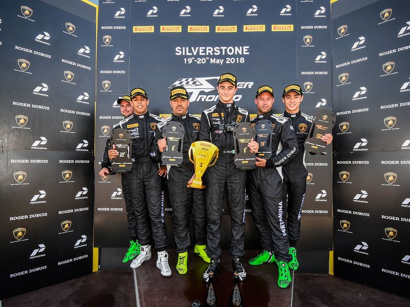 Five Lamborghini Super Trofeo drivers on the Silverstone podium holding trophies, May 2018