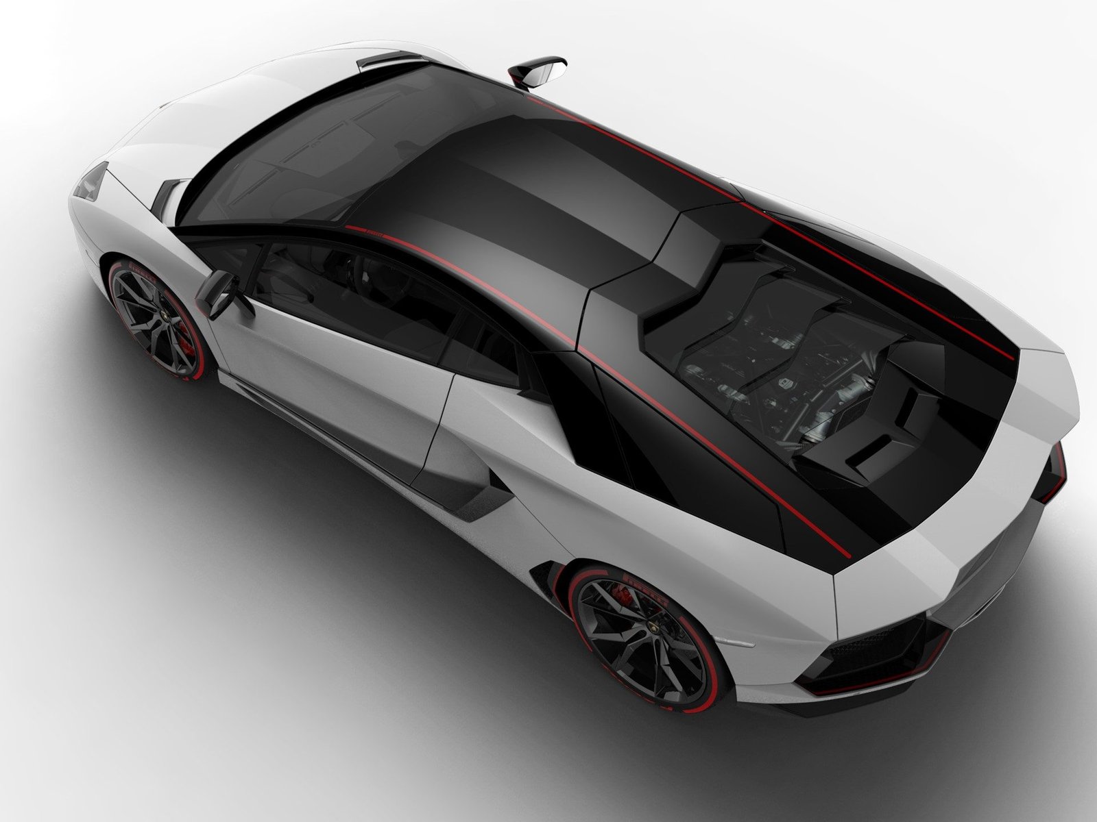 Overhead view of the Aventador Pirelli Edition showing the two-tone white and black livery with red accent stripe and visible V12 engine