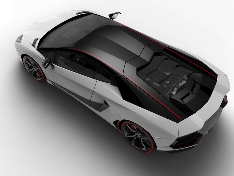 Overhead view of the Aventador Pirelli Edition showing the two-tone white and black livery with red accent stripe and visible V12 engine