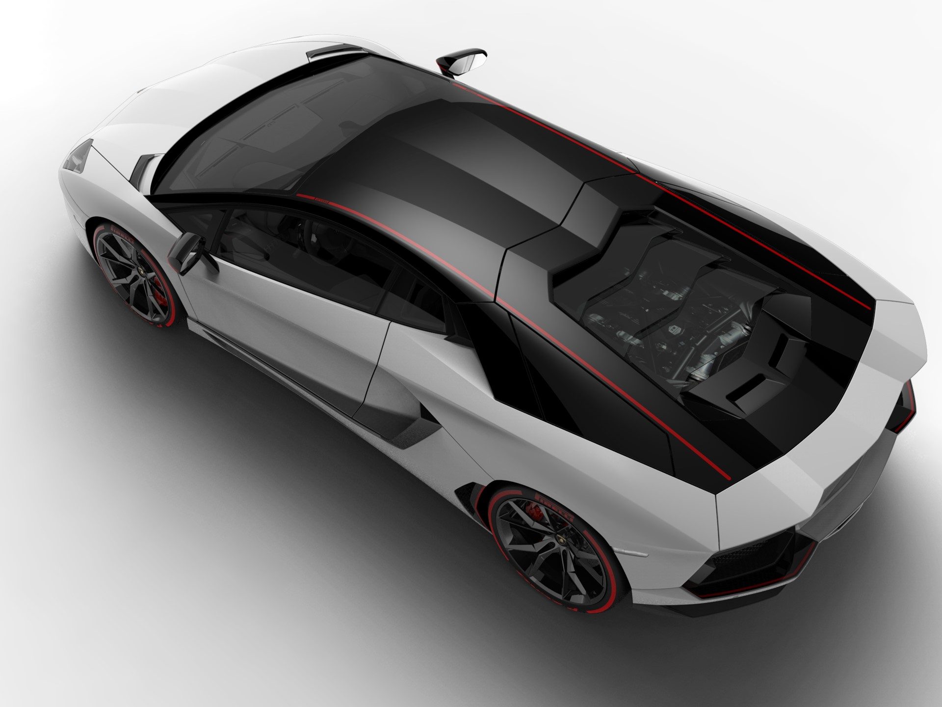 Overhead view of the Aventador Pirelli Edition showing the two-tone white and black livery with red accent stripe and visible V12 engine