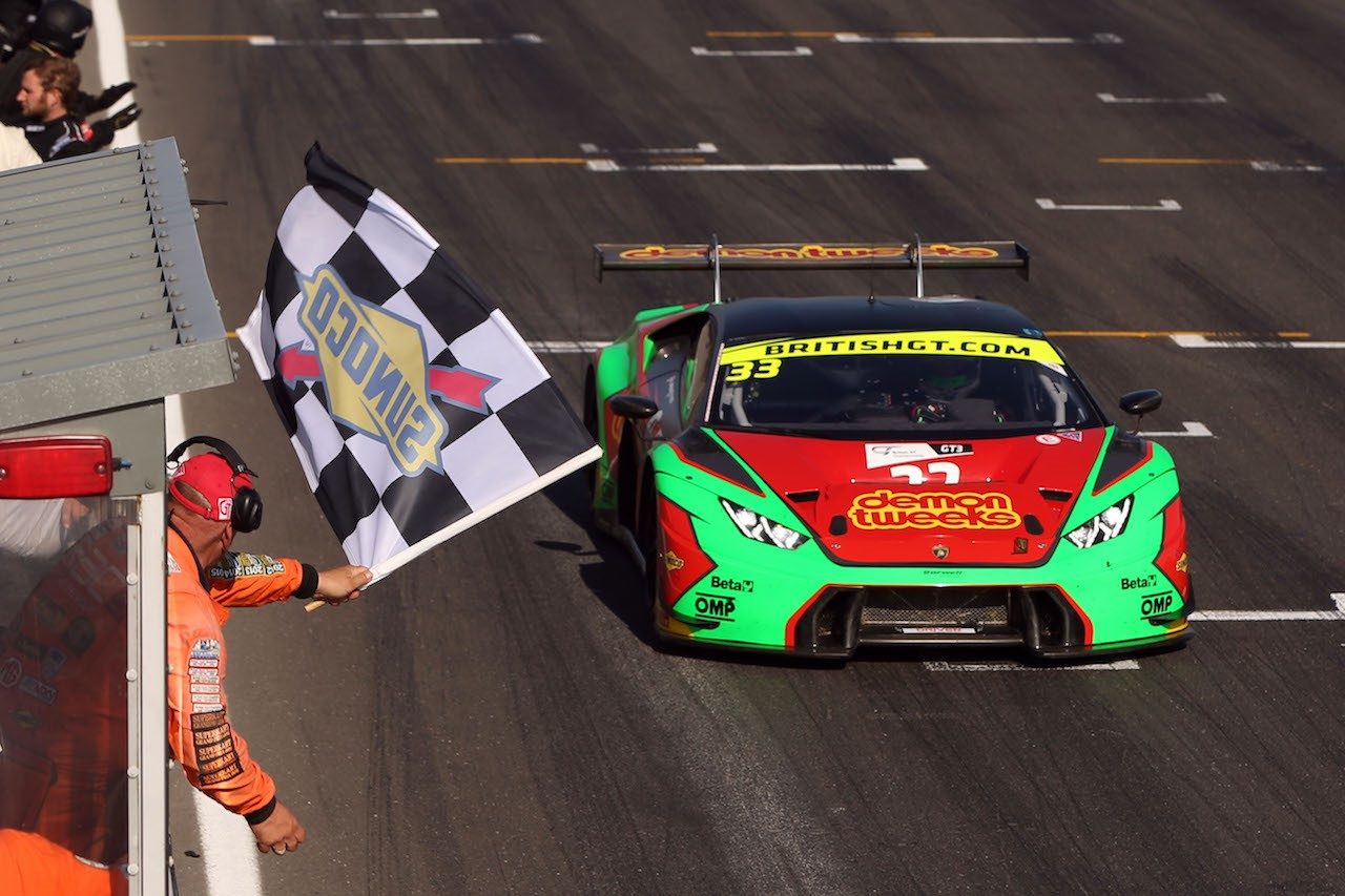 Barwell Motorsport Lamborghini Huracán GT3 crosses the finish line under the checkered flag at Snetterton
