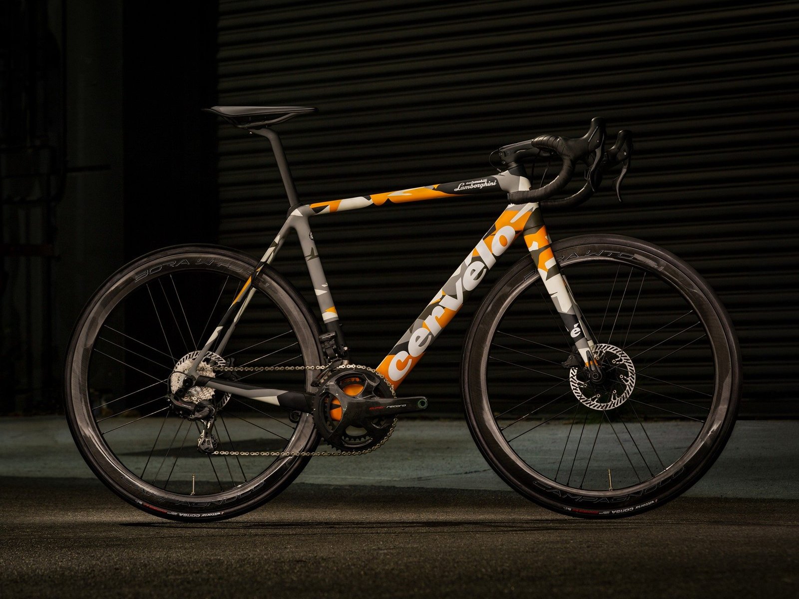 Cervélo R5 Automobili Lamborghini Edition bicycle with grey, orange, and white camouflage livery inspired by the Aventador SVJ