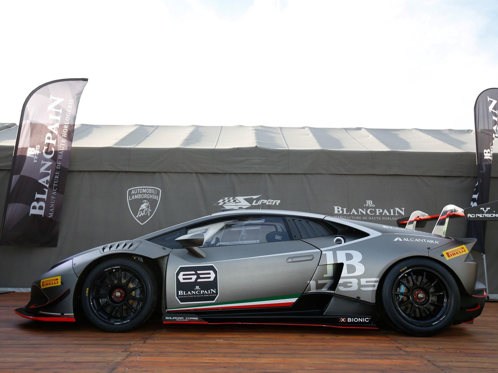 Lamborghini Huracán Super Trofeo race car showing aerodynamic body kit, large rear wing, and lightweight racing wheels