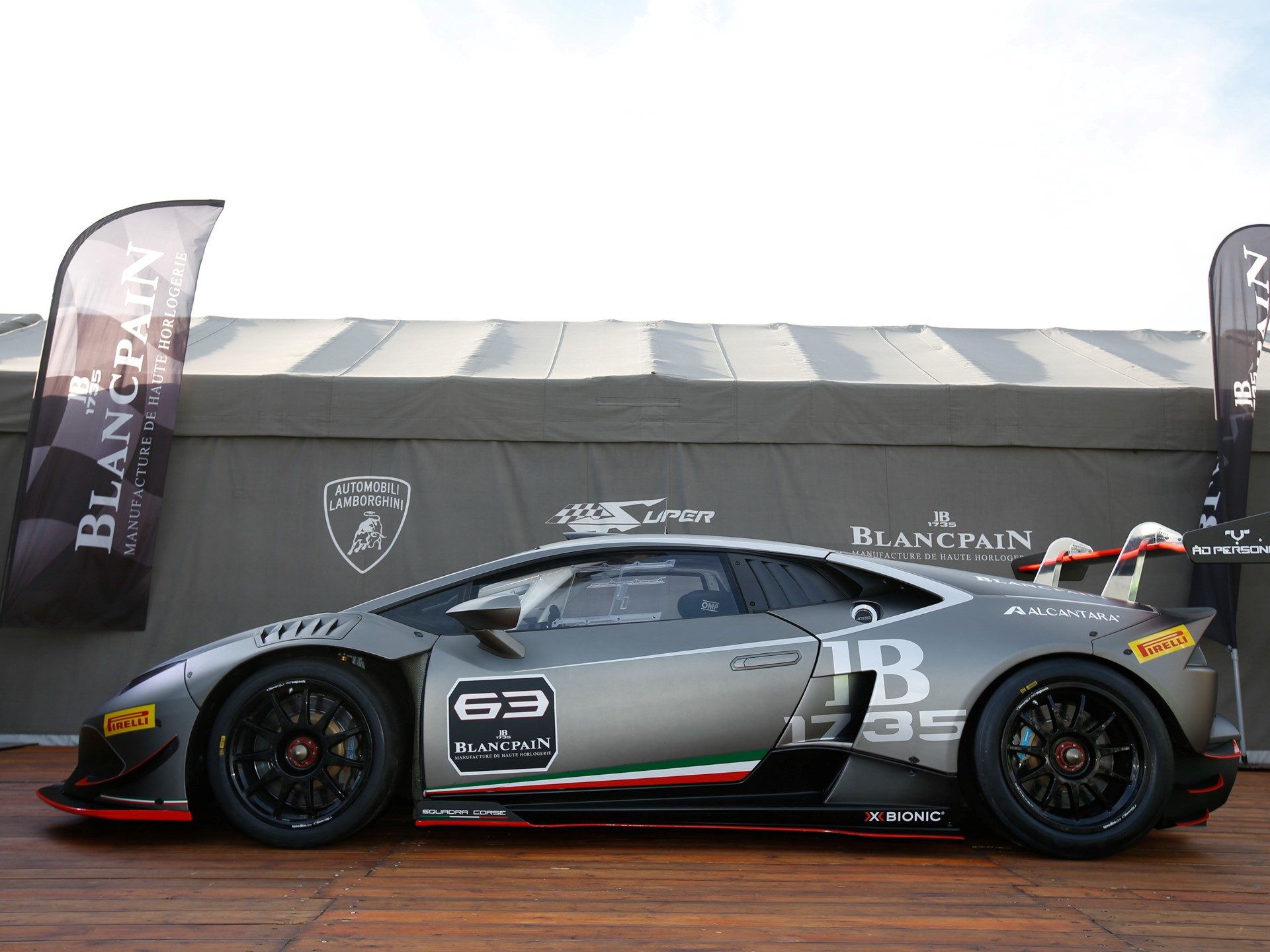 Lamborghini Huracán Super Trofeo race car showing aerodynamic body kit, large rear wing, and lightweight racing wheels