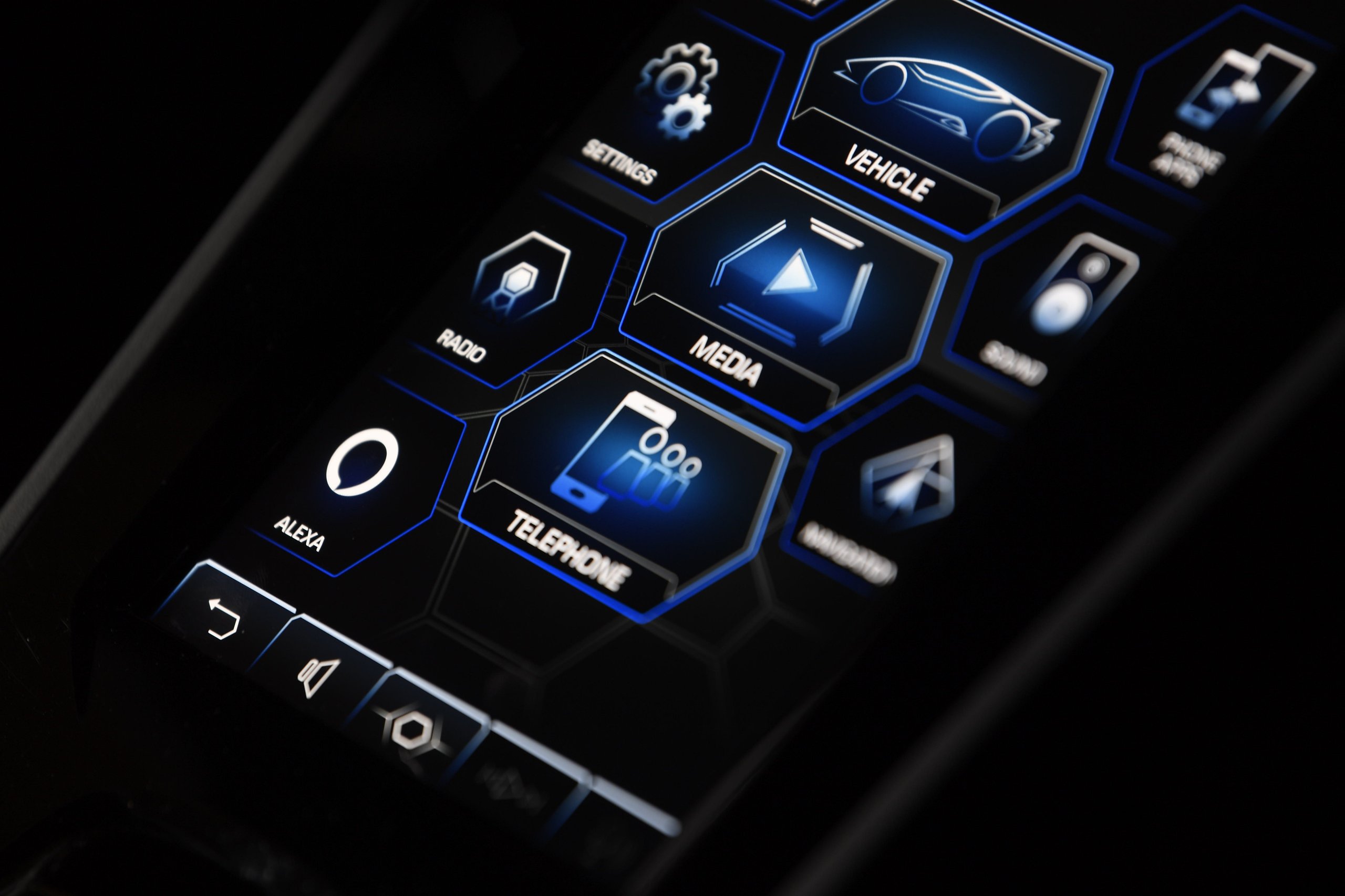 Lamborghini Brought Alexa To Ces 2020, But The Real Story Is What It Revealed About Supercar Cockpits 3 Close-up of the lamborghini huracán evo hmi touchscreen showing hexagonal menu icons including the alexa icon with blue accent lighting