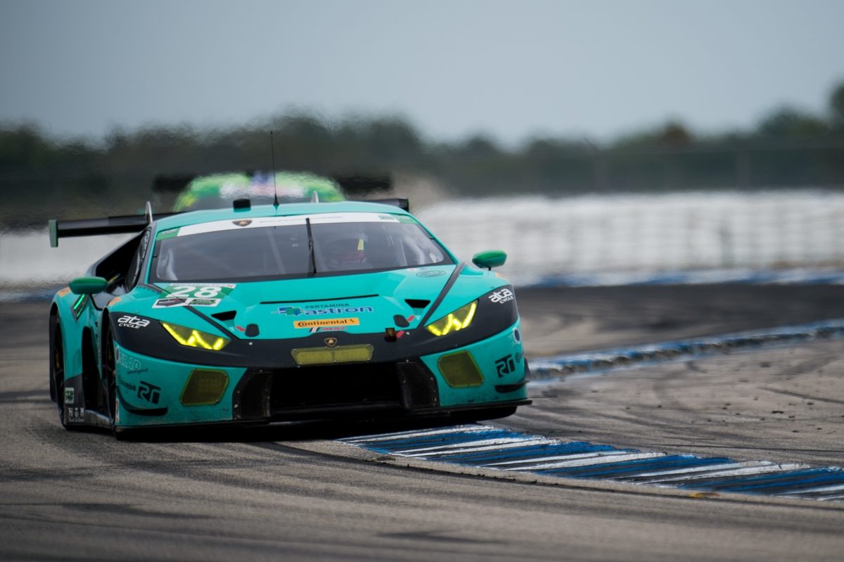 Eight Seconds From Victory: What The Huracán Gt3'S Sebring Fight Tells Us About Lamborghini'S Racing Future 3 Teal lamborghini huracán gt3 navigating a wet turn at sebring with another car visible behind