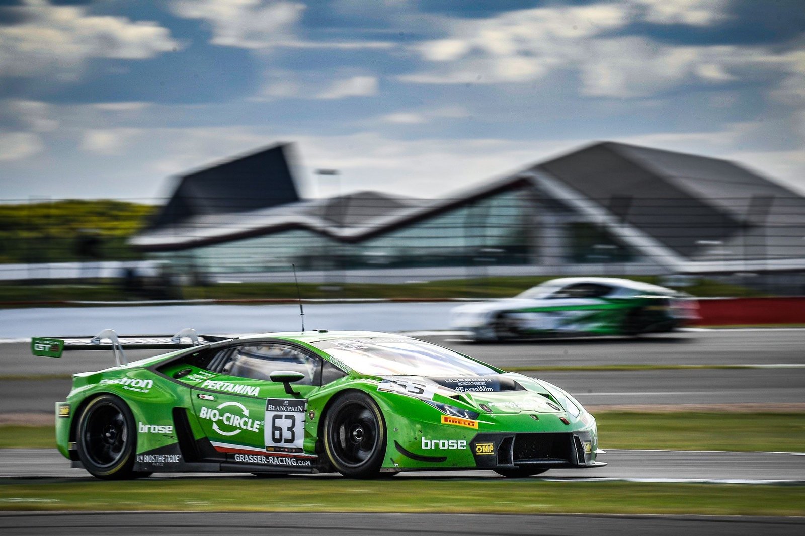 The green Grasser Racing Team Lamborghini Huracán GT3 number 63 at speed on the Silverstone circuit during the Blancpain GT Series Endurance Cup