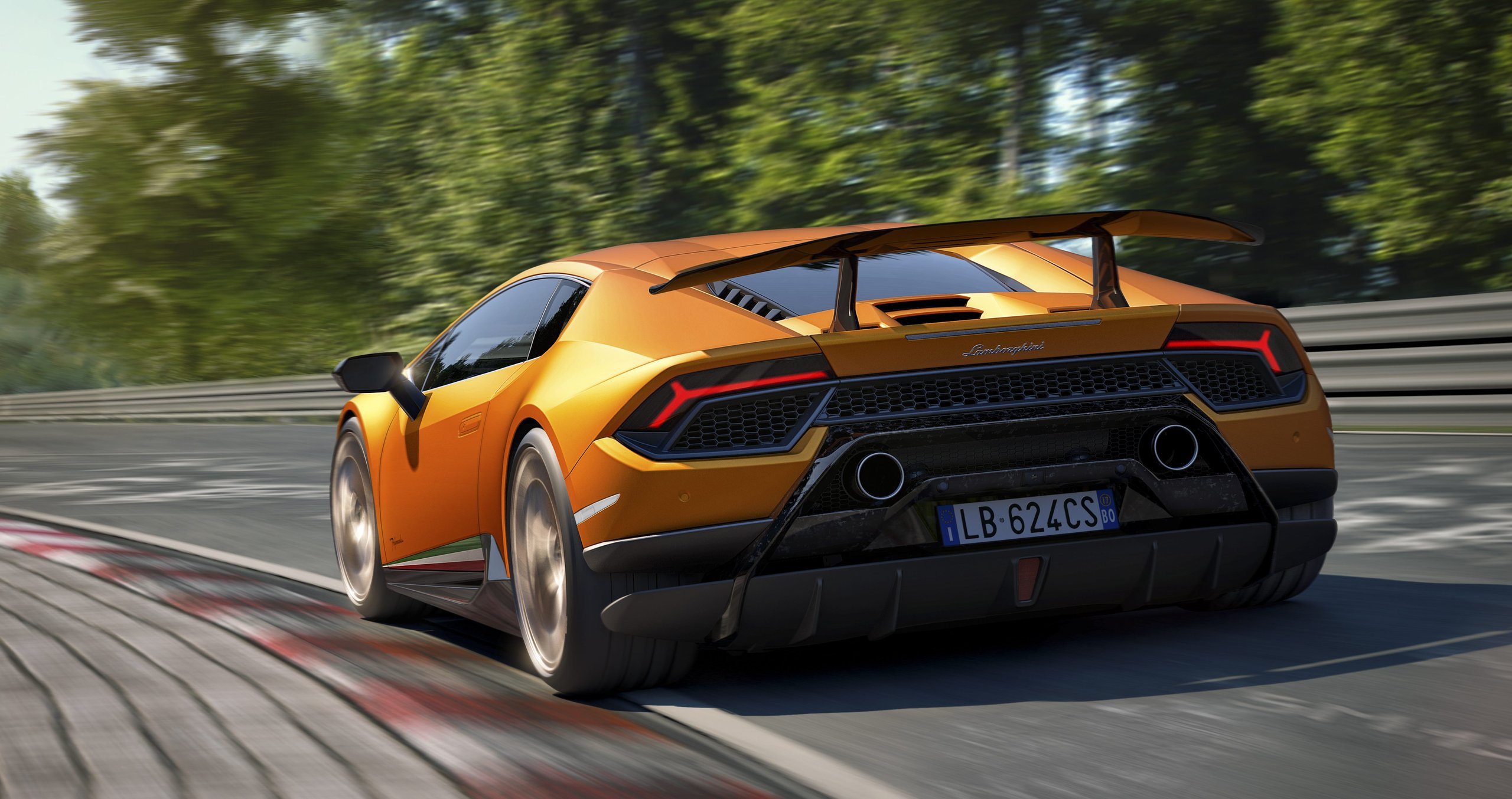 How The Huracán Performante Used Invisible Aerodynamics To Beat A 887-Hp Hybrid Around The Nürburgring 3 Orange huracán performante cornering hard on a racetrack, rear three-quarter view showing the ala rear wing, aggressive diffuser, and italian tricolore detail