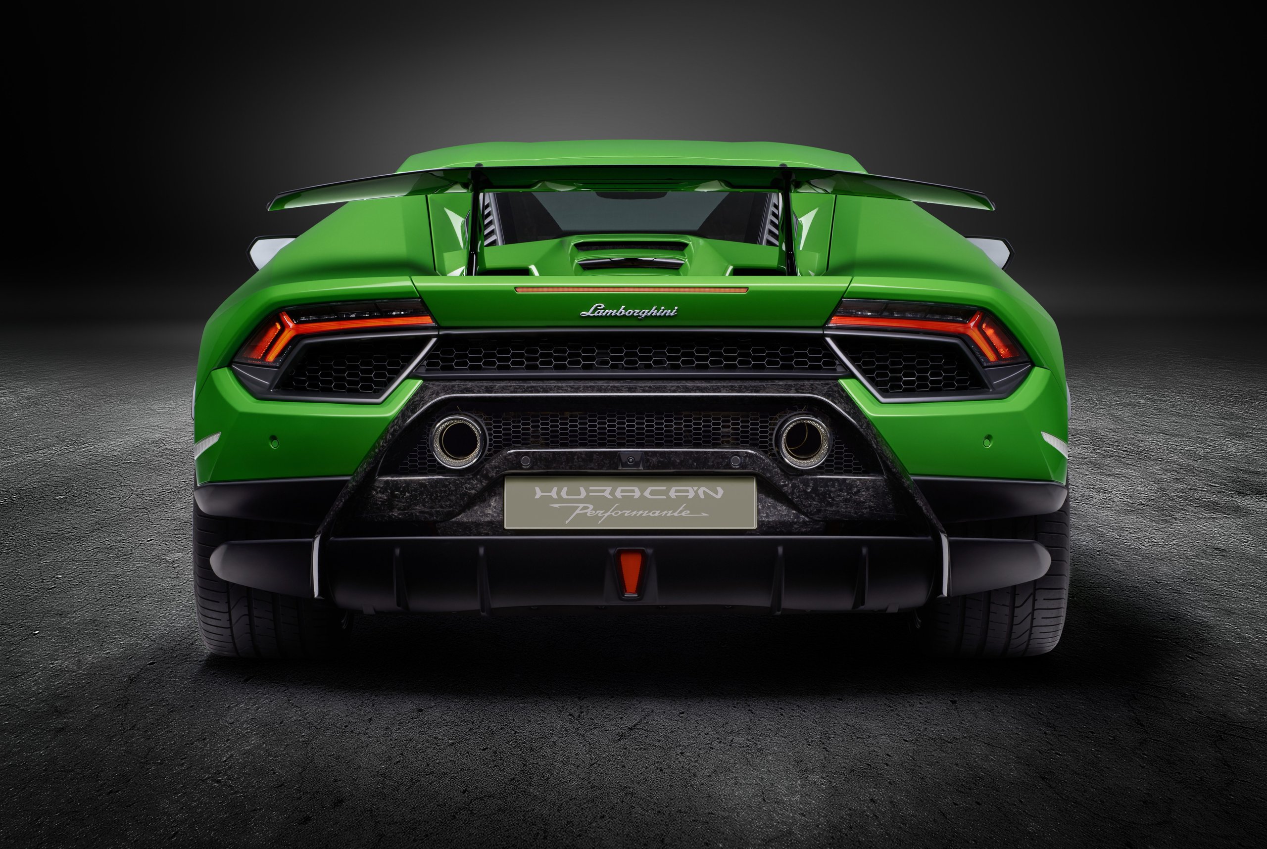 How The Huracán Performante Used Invisible Aerodynamics To Beat A 887-Hp Hybrid Around The Nürburgring 5 Green huracán performante rear view in studio showing the forged composite rear wing, carbon fiber diffuser, and high-mounted dual exhaust