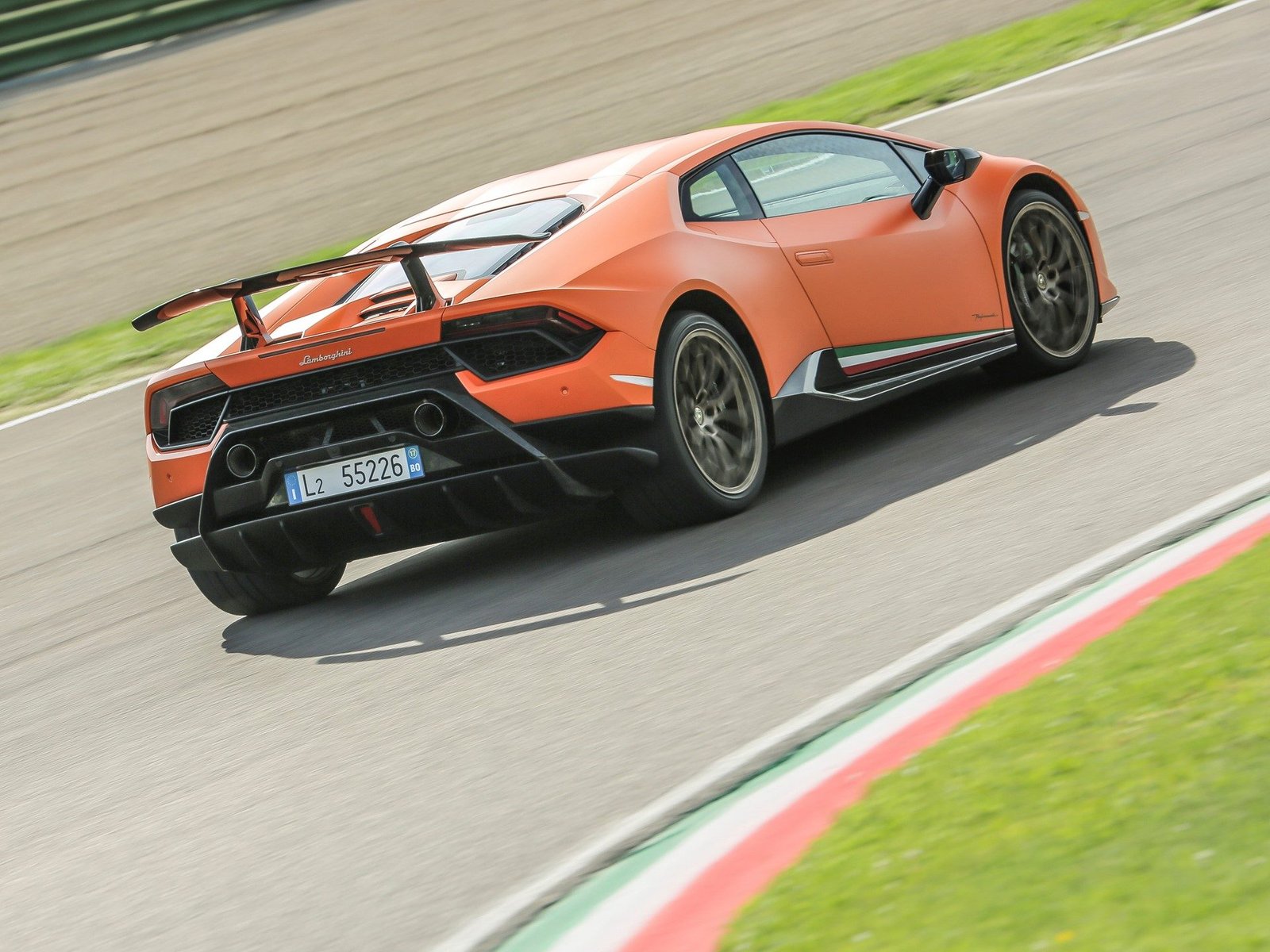 Rear view of the Lamborghini Huracán Performante on track, showing the fixed rear wing with ALA system and aggressive diffuser