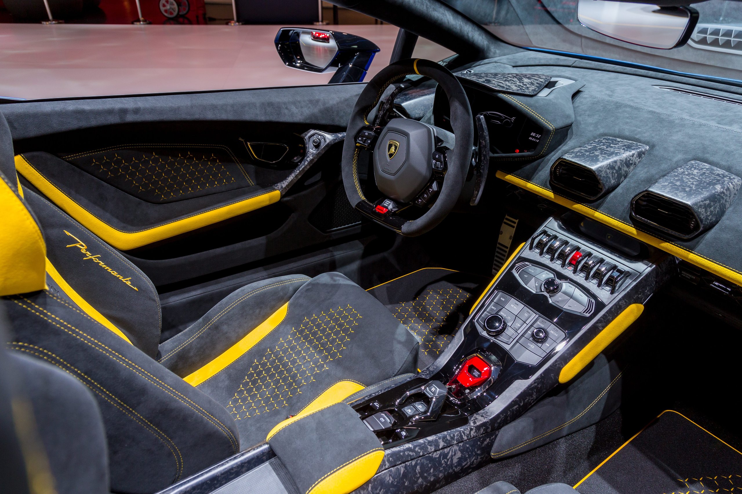 How Lamborghini Kept The Performante Spyder From Being A Compromise 9 Interior of lamborghini huracán performante spyder with black alcantara, yellow accents, carbon fiber details, and hexagonal stitching