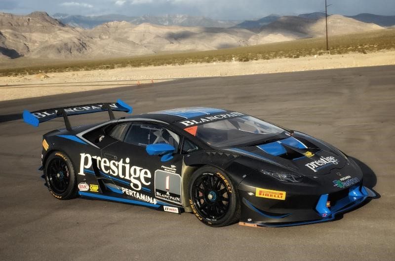 Lamborghini Huracán Super Trofeo race car on track showing large rear wing and aerodynamic body kit