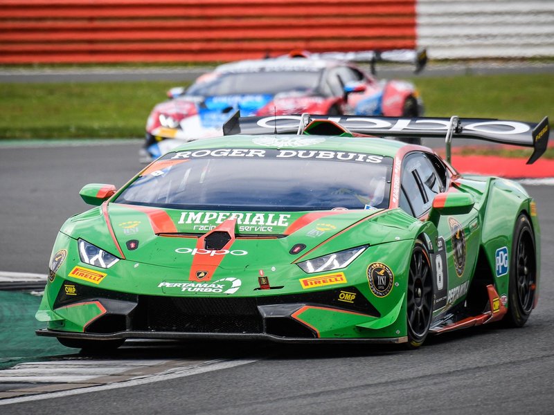 Lamborghini Huracán Super Trofeo race car at speed with aggressive aerodynamic elements and large rear wing visible