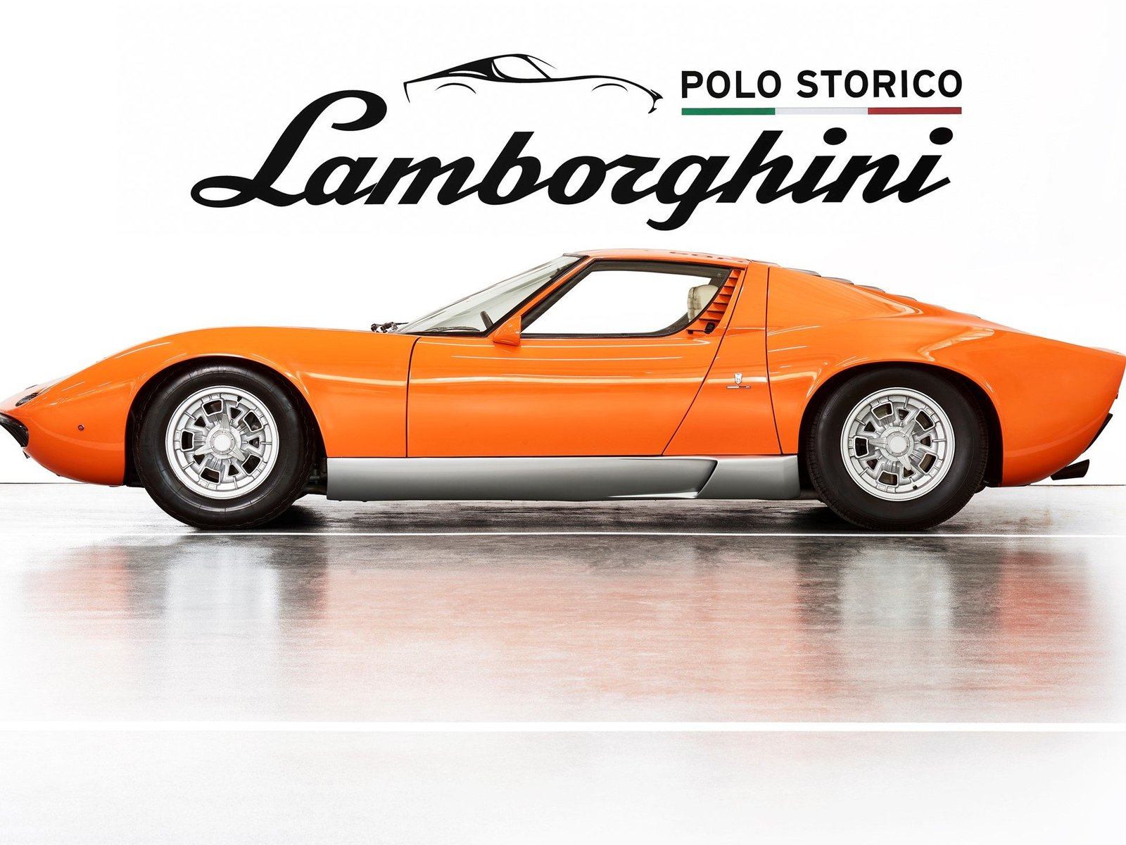 Orange Lamborghini Miura P400 certified by Polo Storico, shown in studio with heritage branding