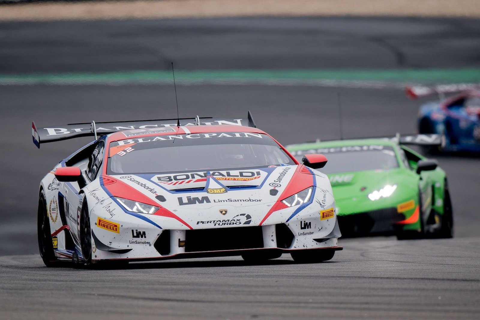 Lamborghini Huracán Super Trofeo race cars battling for position on track during the Blancpain Super Trofeo Europe round at the Nürburgring