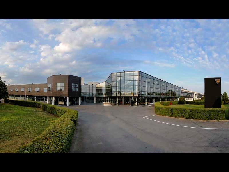 Lamborghini headquarters factory building in Sant'Agata Bolognese with glass facades and the Lamborghini emblem
