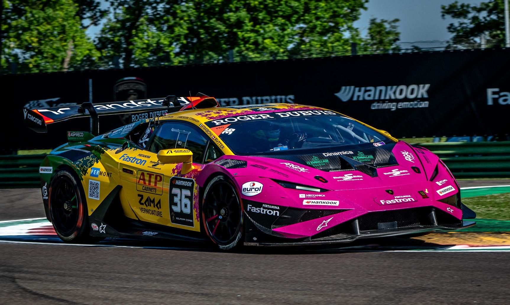 Thirty Drivers, One Goal: Inside Lamborghini'S 2026 Young Driver Programs And The Formula Medicine Gambit 11 A vibrant pink, yellow, and black lamborghini huracán gt3 evo race car on a racetrack corner