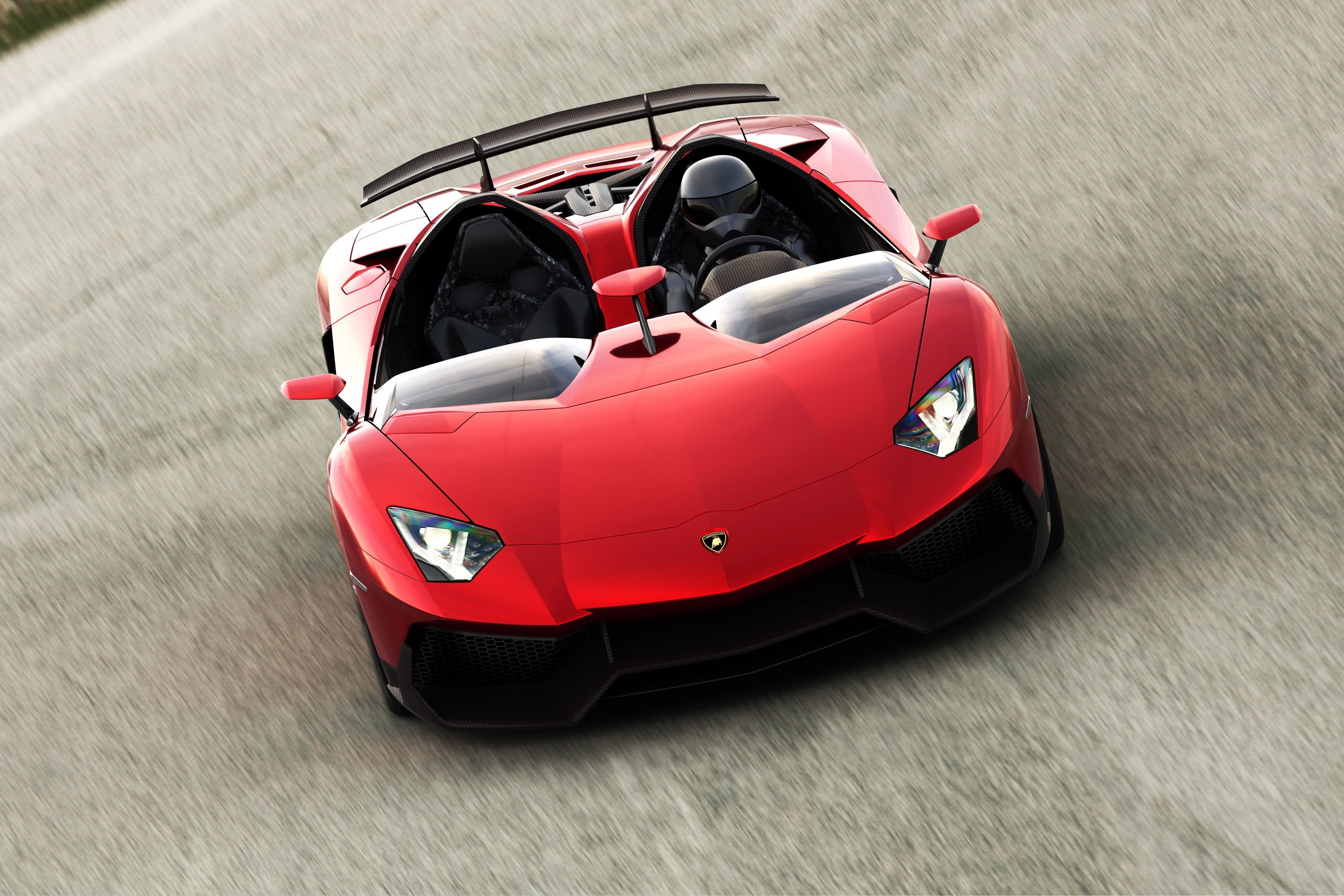 10,000 Aventadors Later, Lamborghini'S V12 Flagship Wrote The Playbook For A Decade Of Supercar Dominance 3 Red lamborghini aventador j in motion, showing its open barchetta cockpit and aggressive aerodynamic design