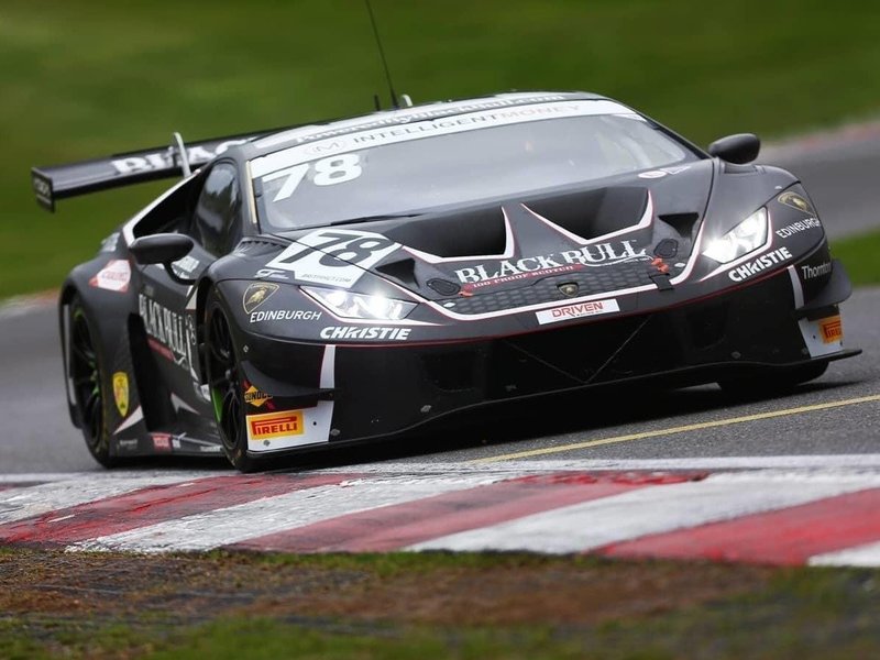 The #78 Barwell Motorsport Lamborghini Huracán GT3 Evo mid-corner at Brands Hatch with headlights illuminated and rear wing visible