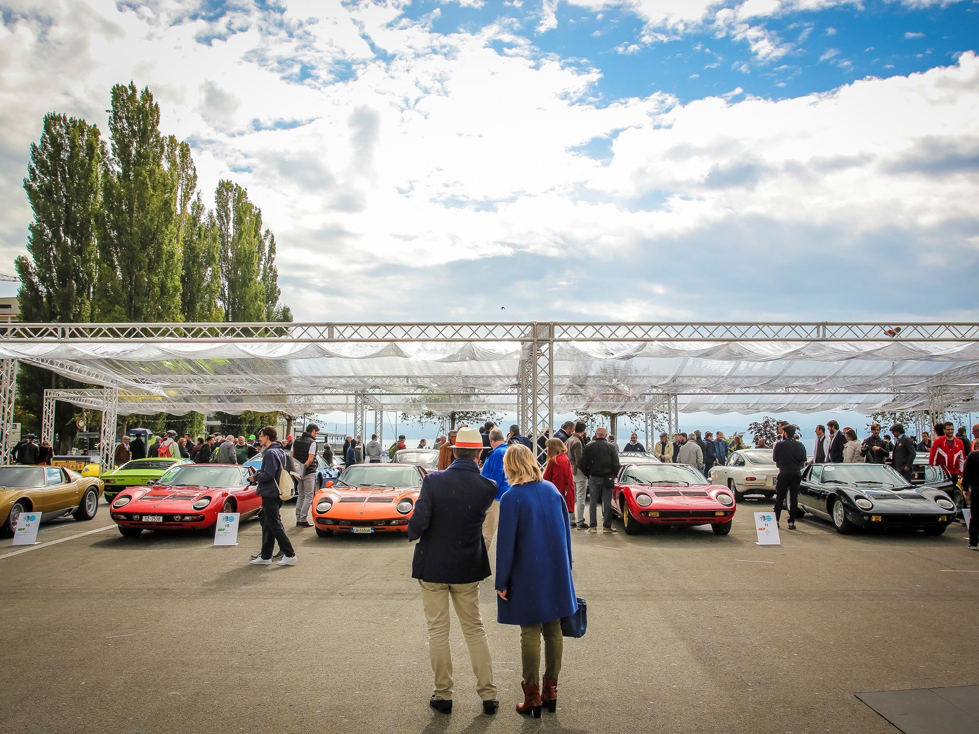 Multiple Lamborghini Miuras in various colors displayed at the inaugural Lamborghini Concours d'Élégance in Neuchâtel, Switzerland
